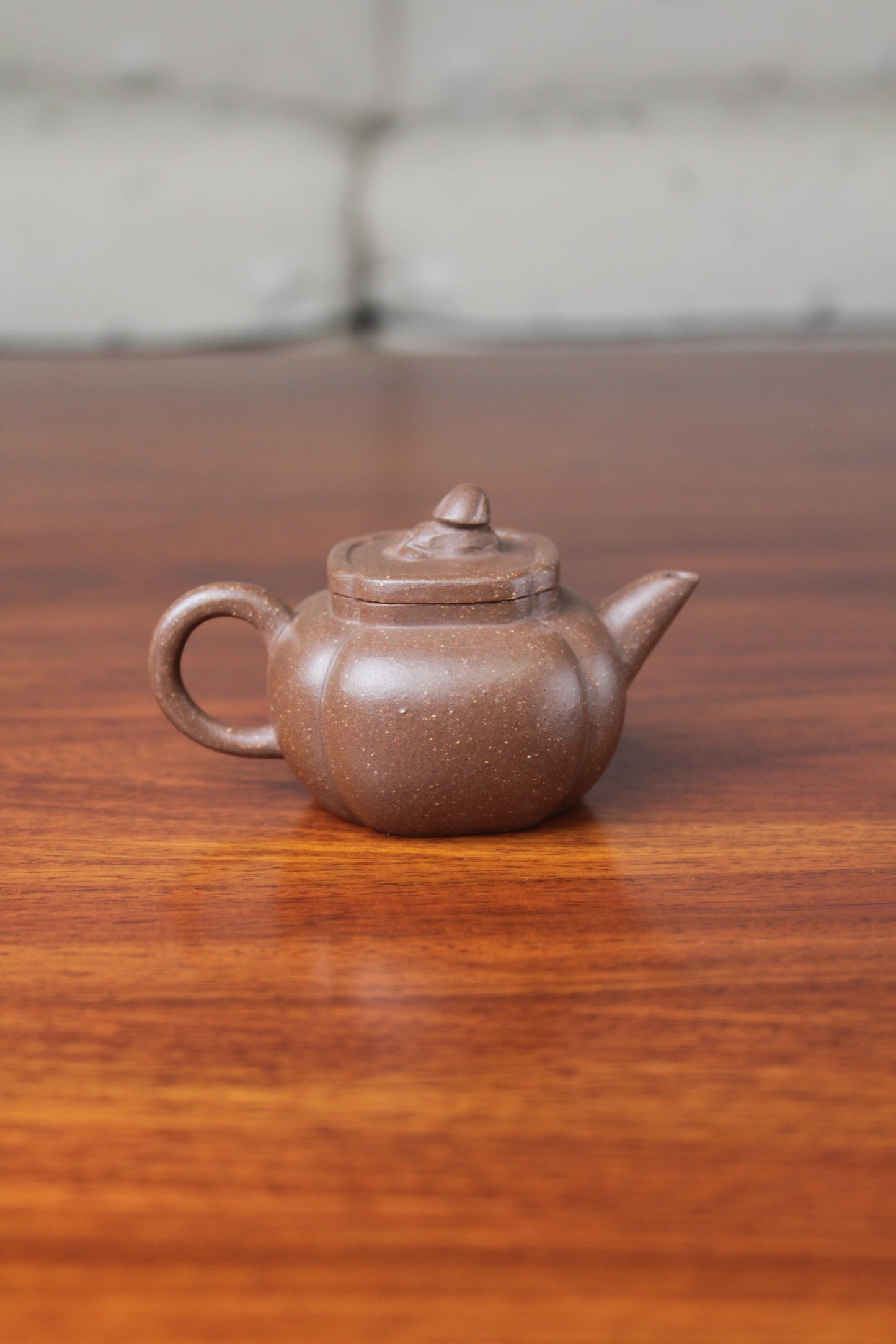 Back view of the Artistic teapot on the table