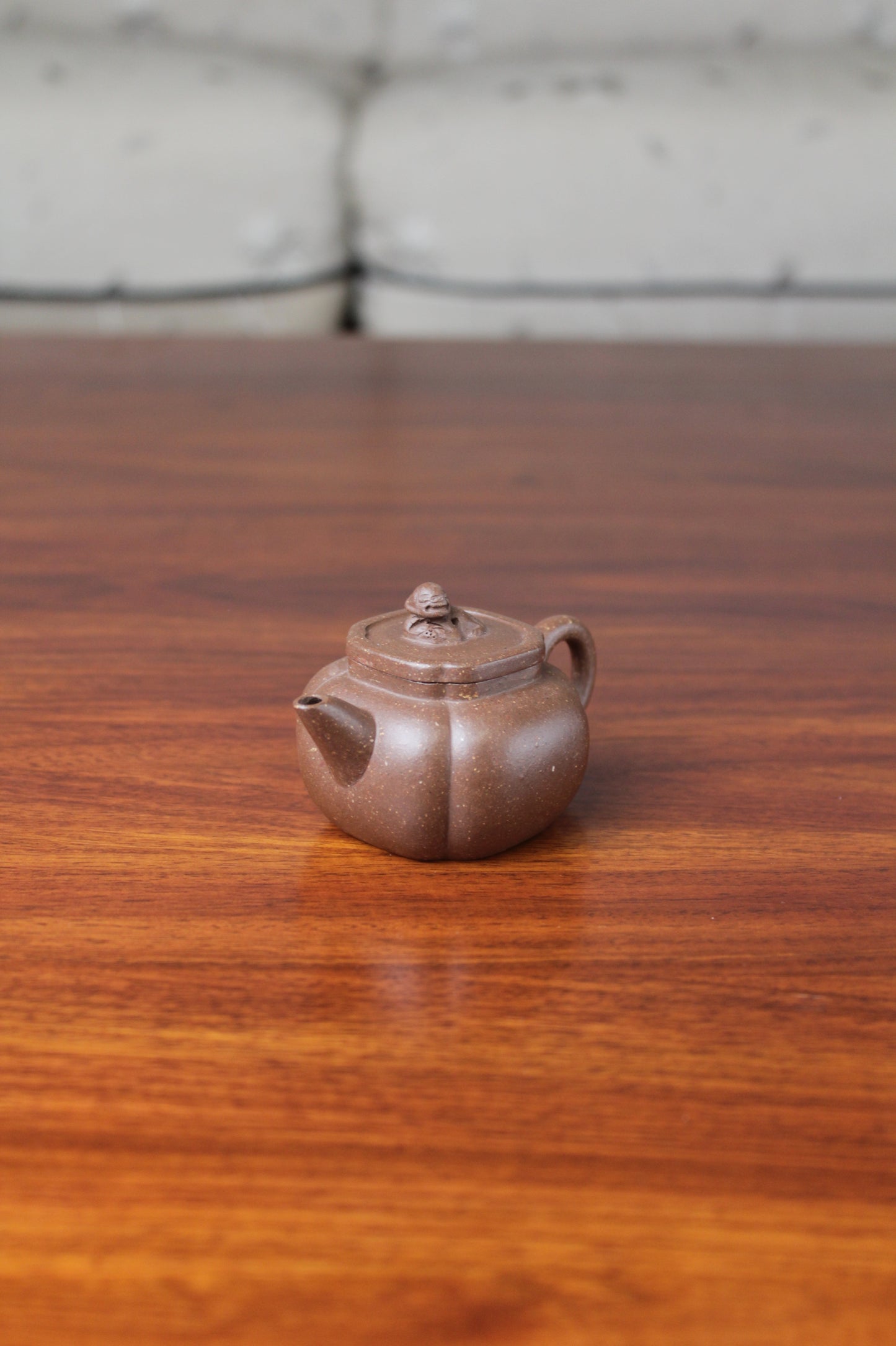 Right view of the Artistic teapot on the table