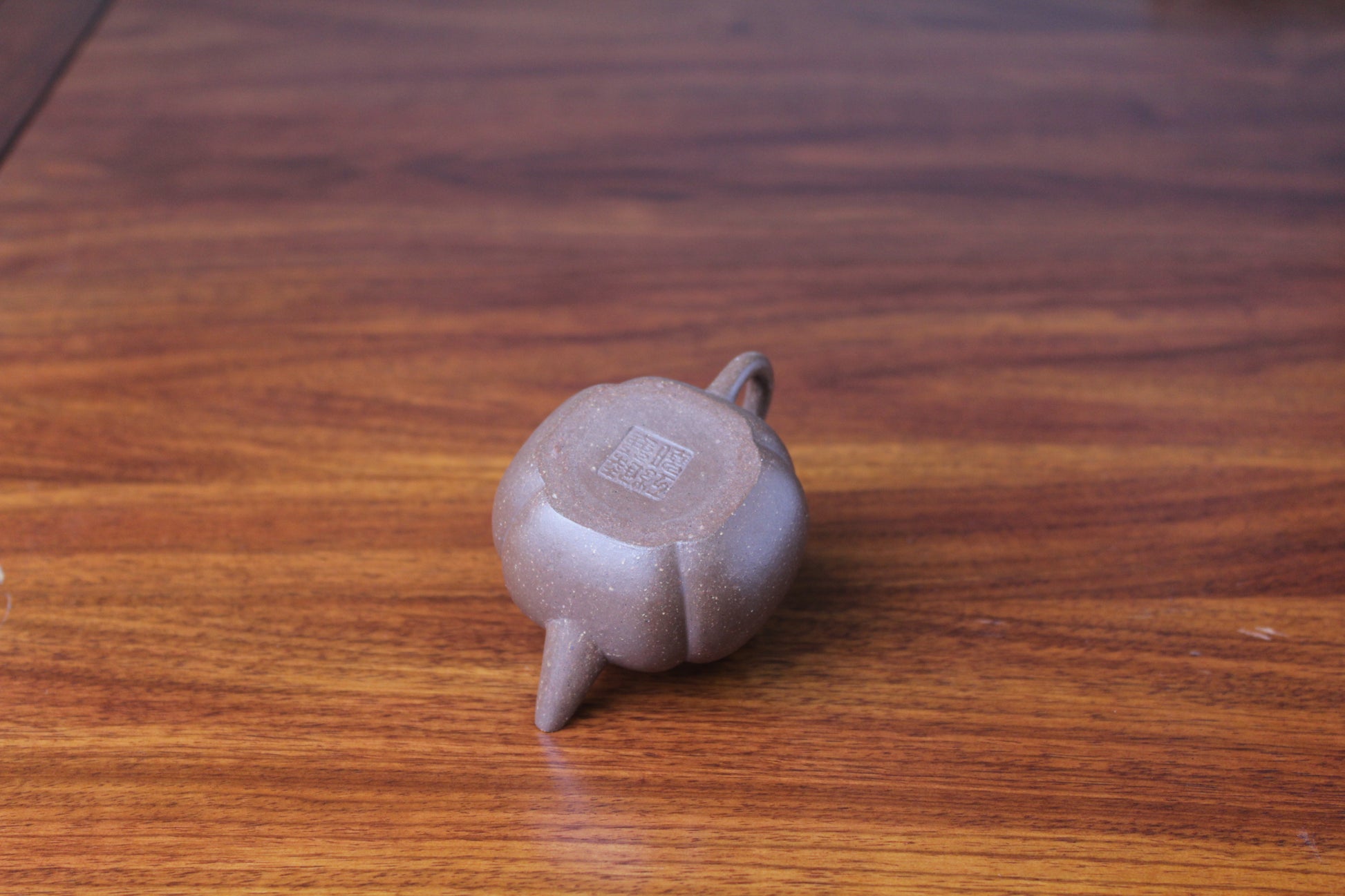 Bottom of the Artistic teapot on the table
