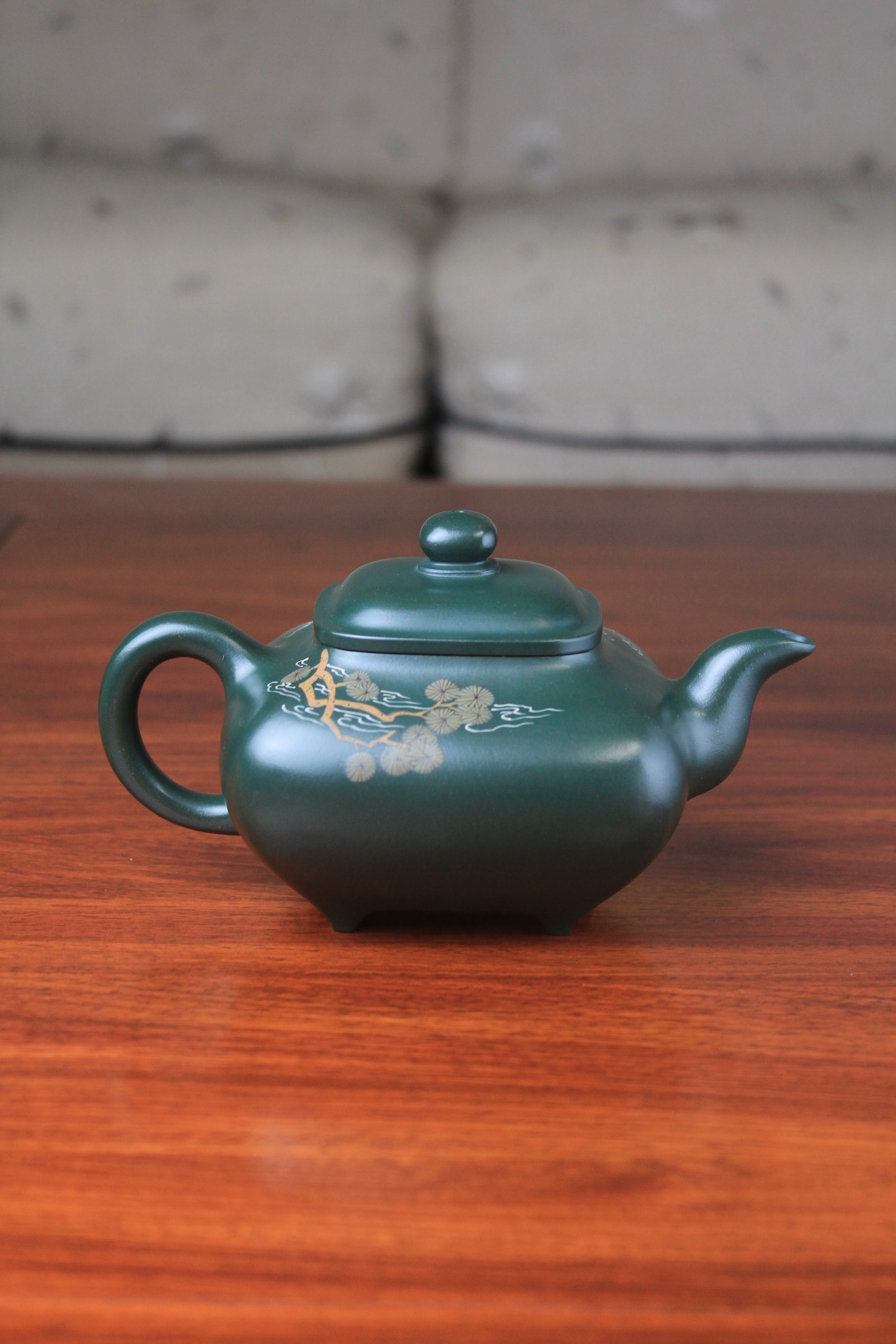 The back of the Artistic teapot from teapot artist on the table