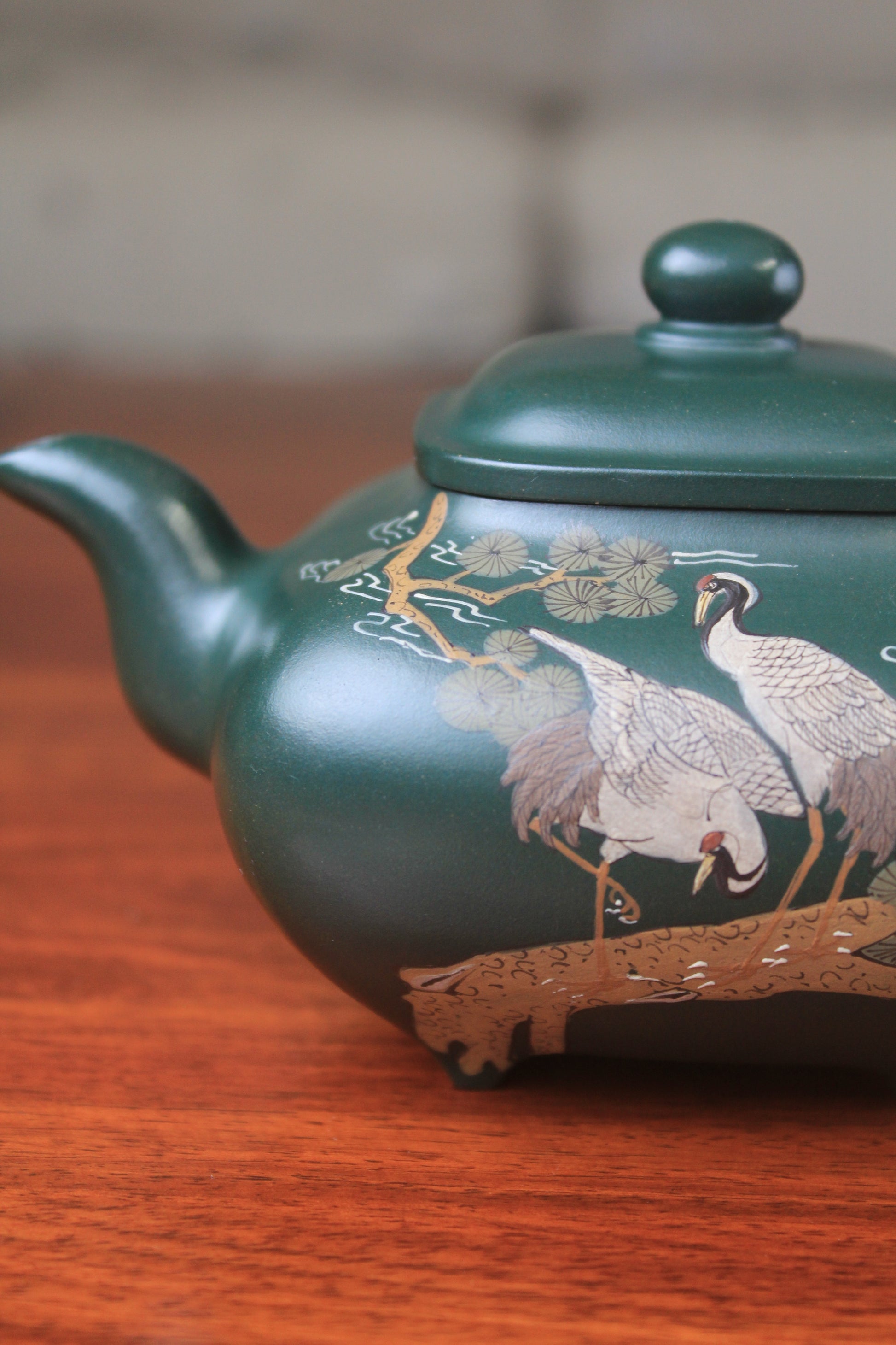 The spout of the Artistic teapot from teapot artist on the table