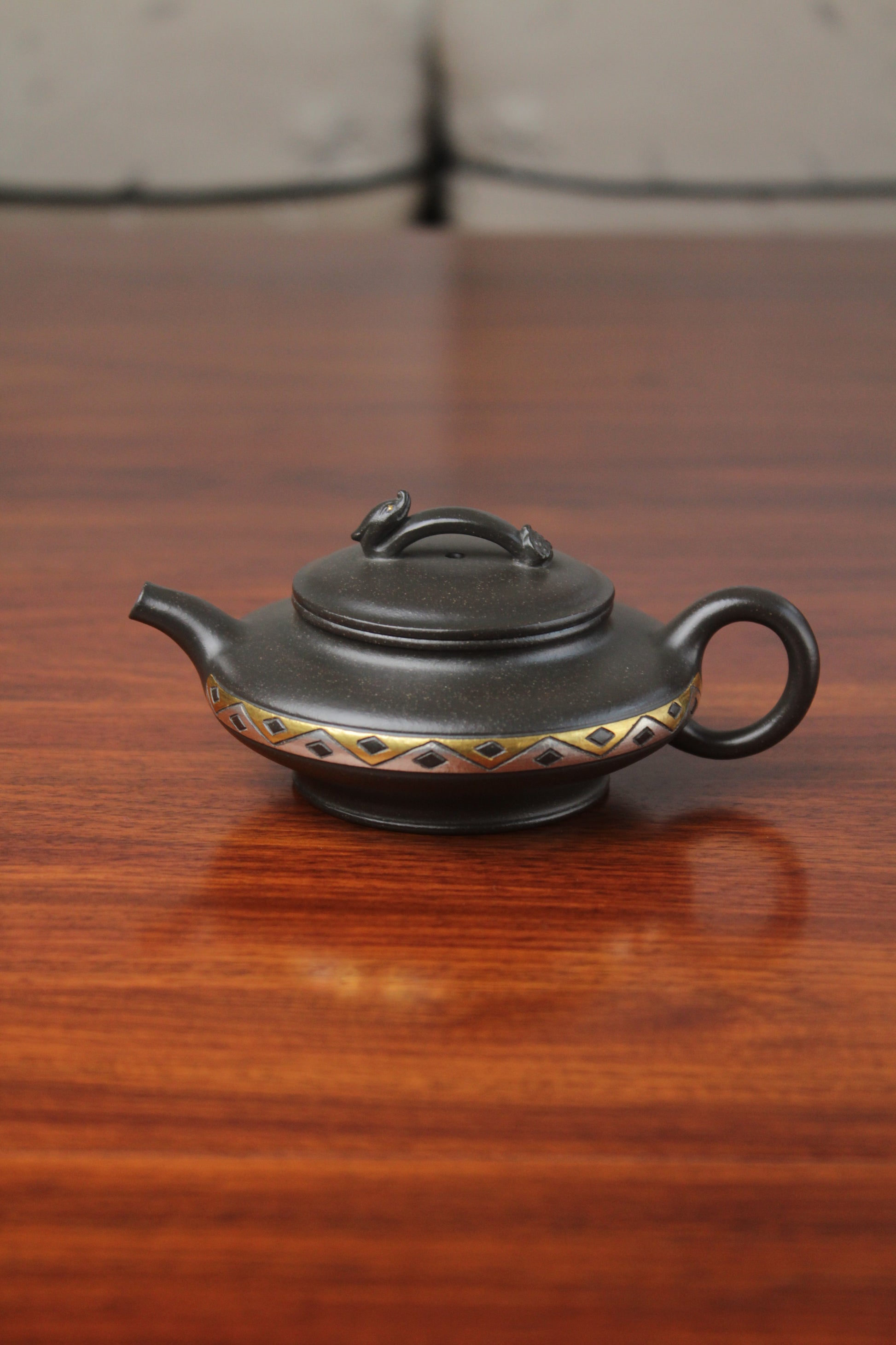 front of chinese pot made with purple clay from yixing zisha art gallery