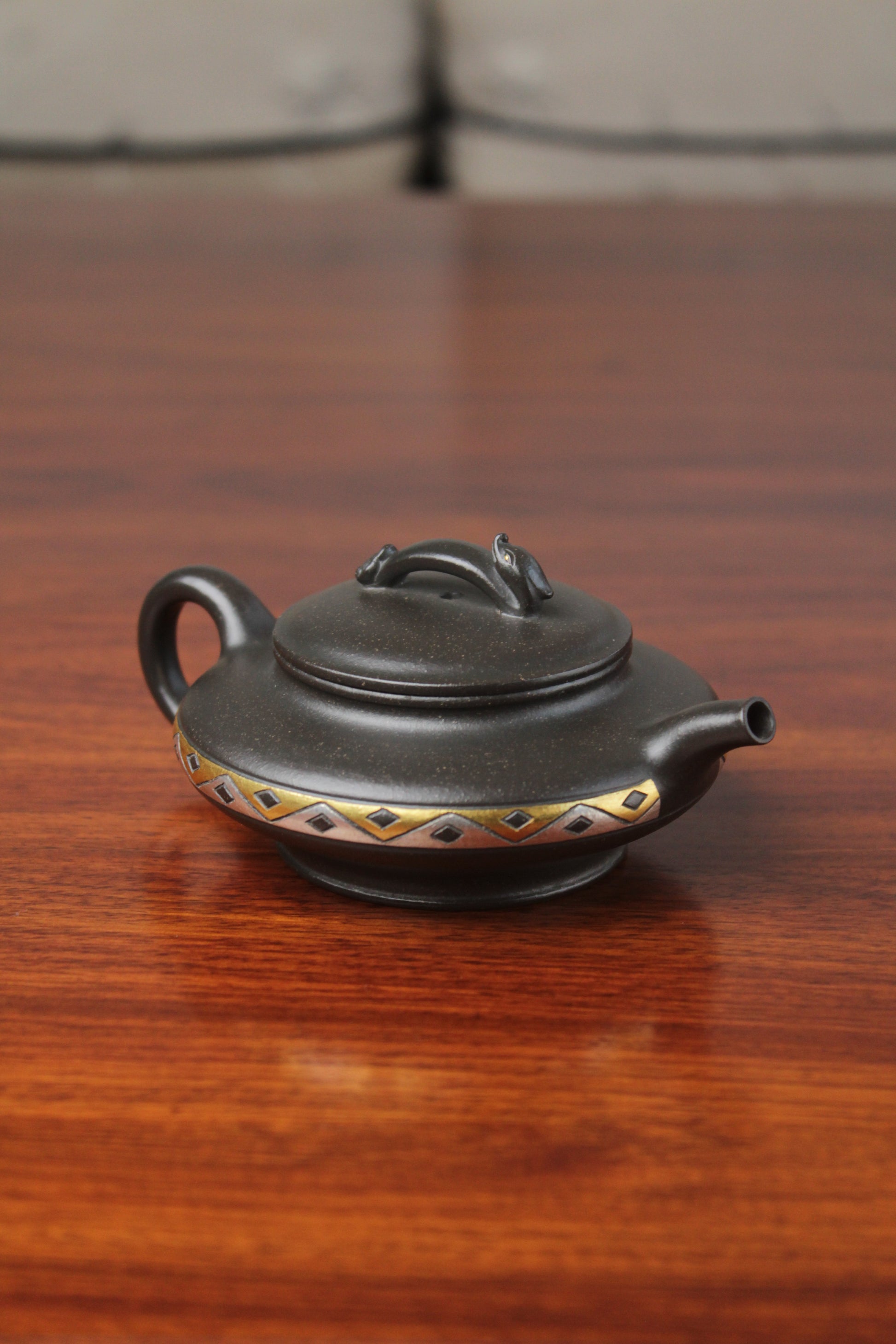 left of chinese pot made with purple clay from yixing zisha art gallery