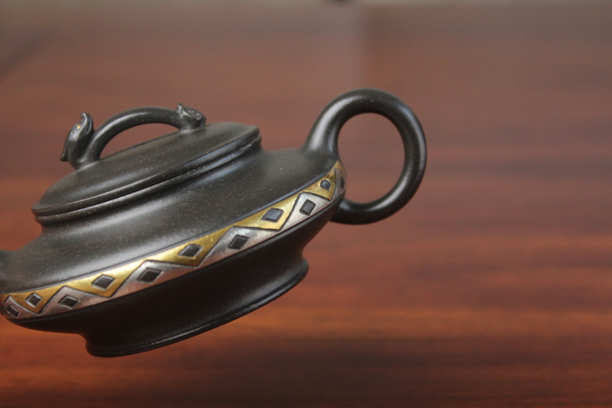 handle detail of chinese pot made with purple clay from yixing zisha art gallery