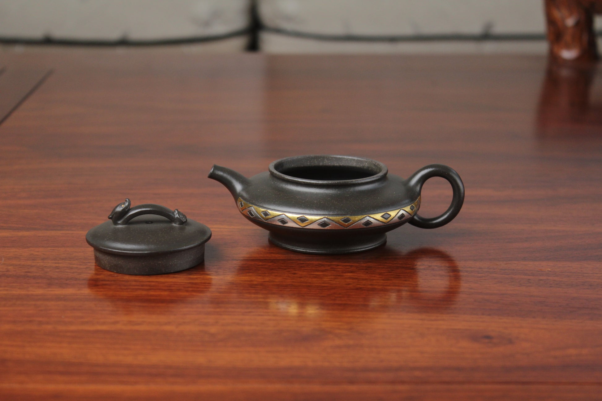 detail of chinese pot made with purple clay from yixing zisha art gallery