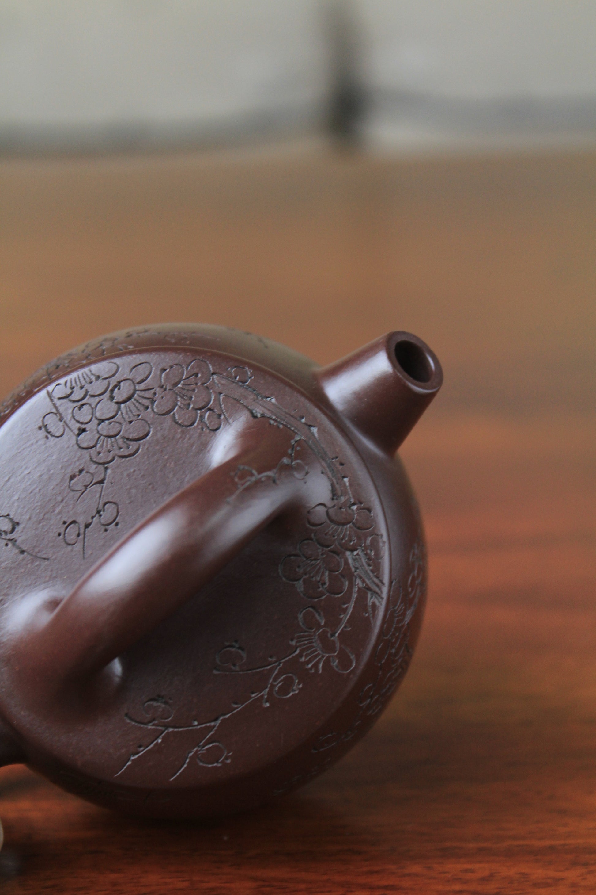 Lid of chinese teapot handmade with purple clay on the table