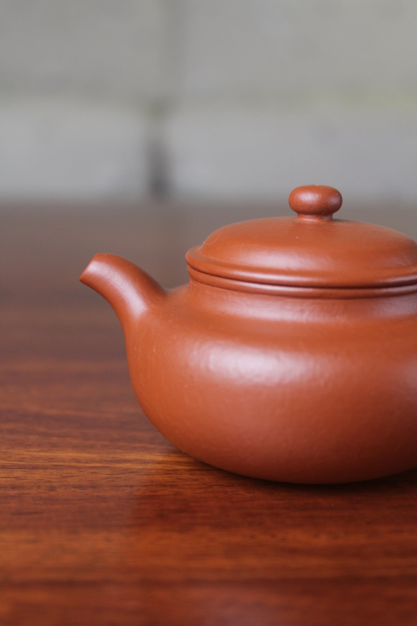 spout of the chinese teapot fang gu on the table