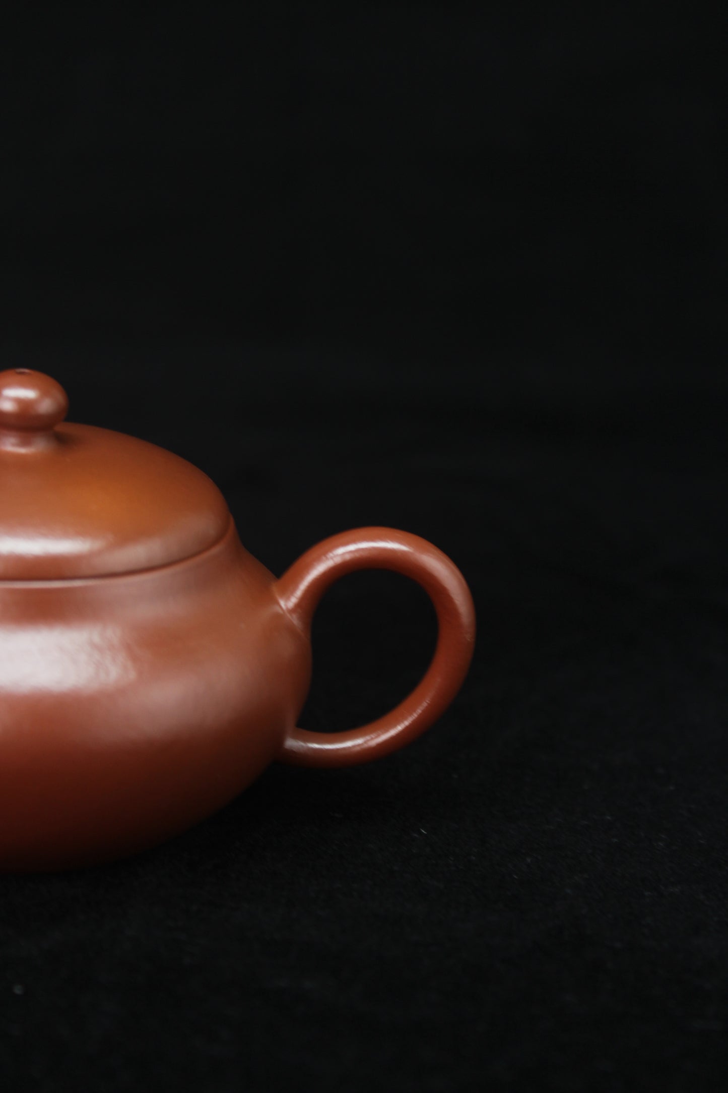 Handle of Clay teapot handmade with purple clay from zisha art galley
