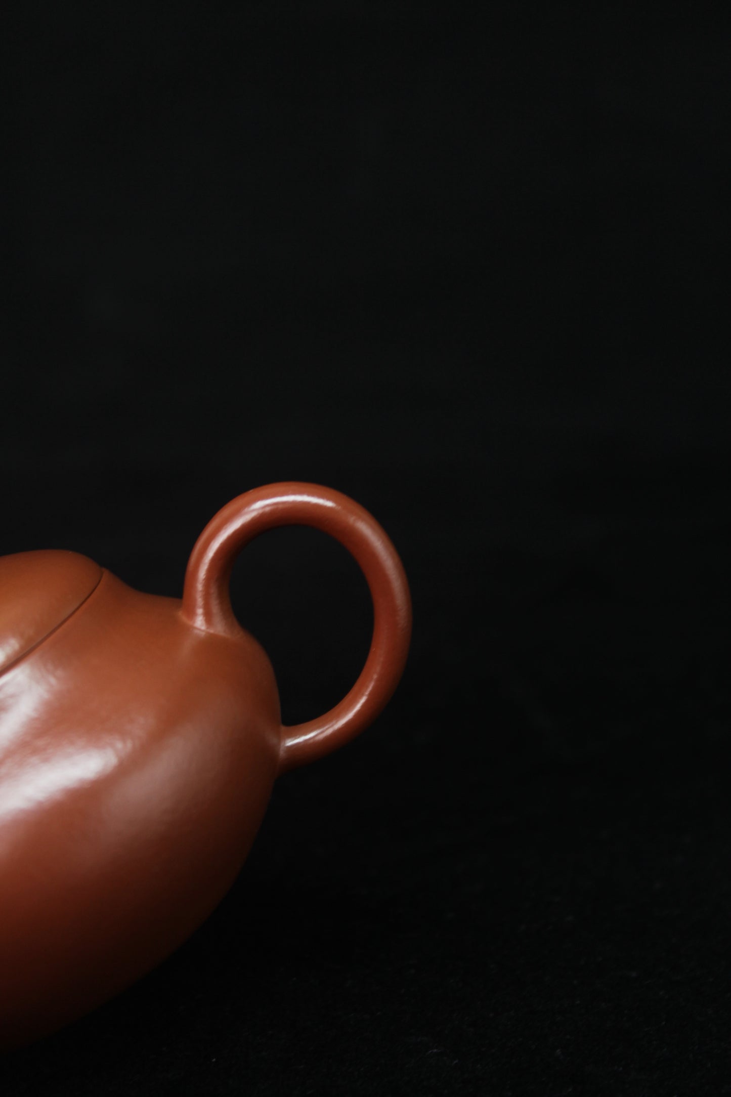 Handle detail of Clay teapot handmade with purple clay from zisha art galley