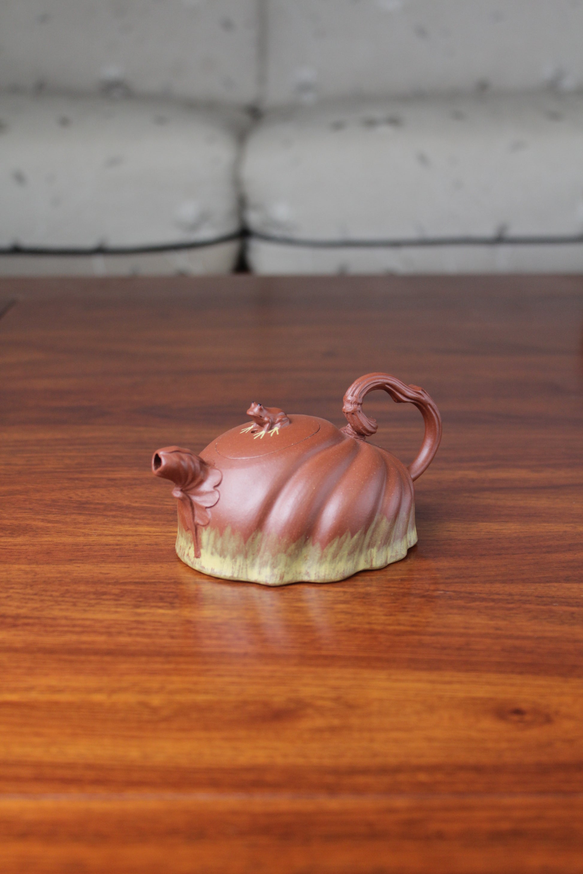 Right view of the Collectible teapot handmade by teapot artist on the table