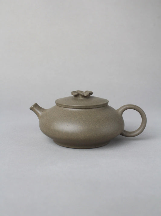 collectble teapot named flower on the table