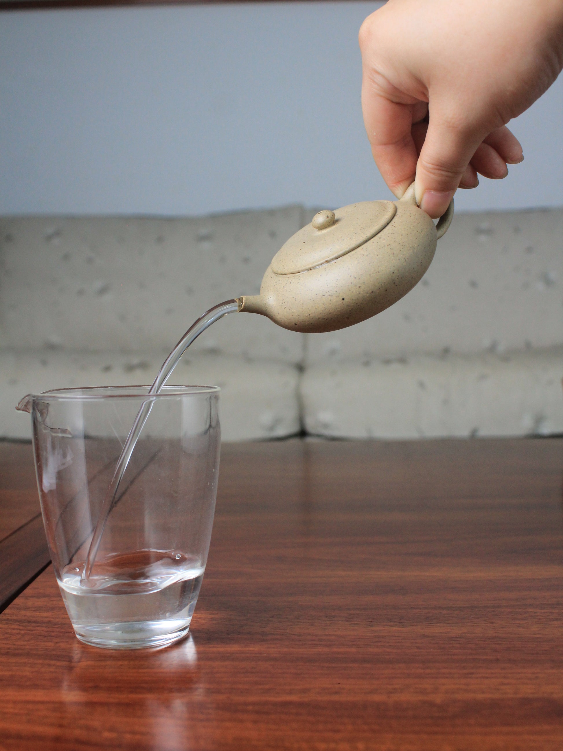Pour of the loose leaf teapot on the table
