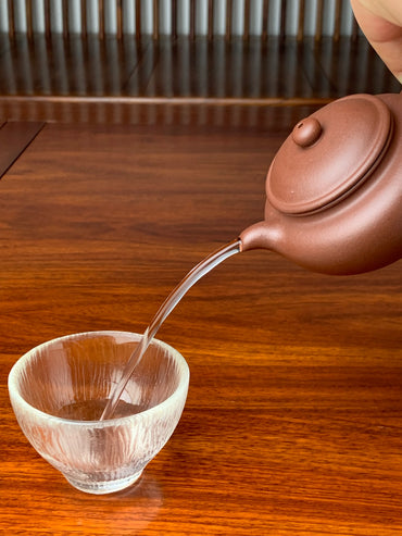 the perfect pour of the handmade yixing clay teapot named yong fu lian zi