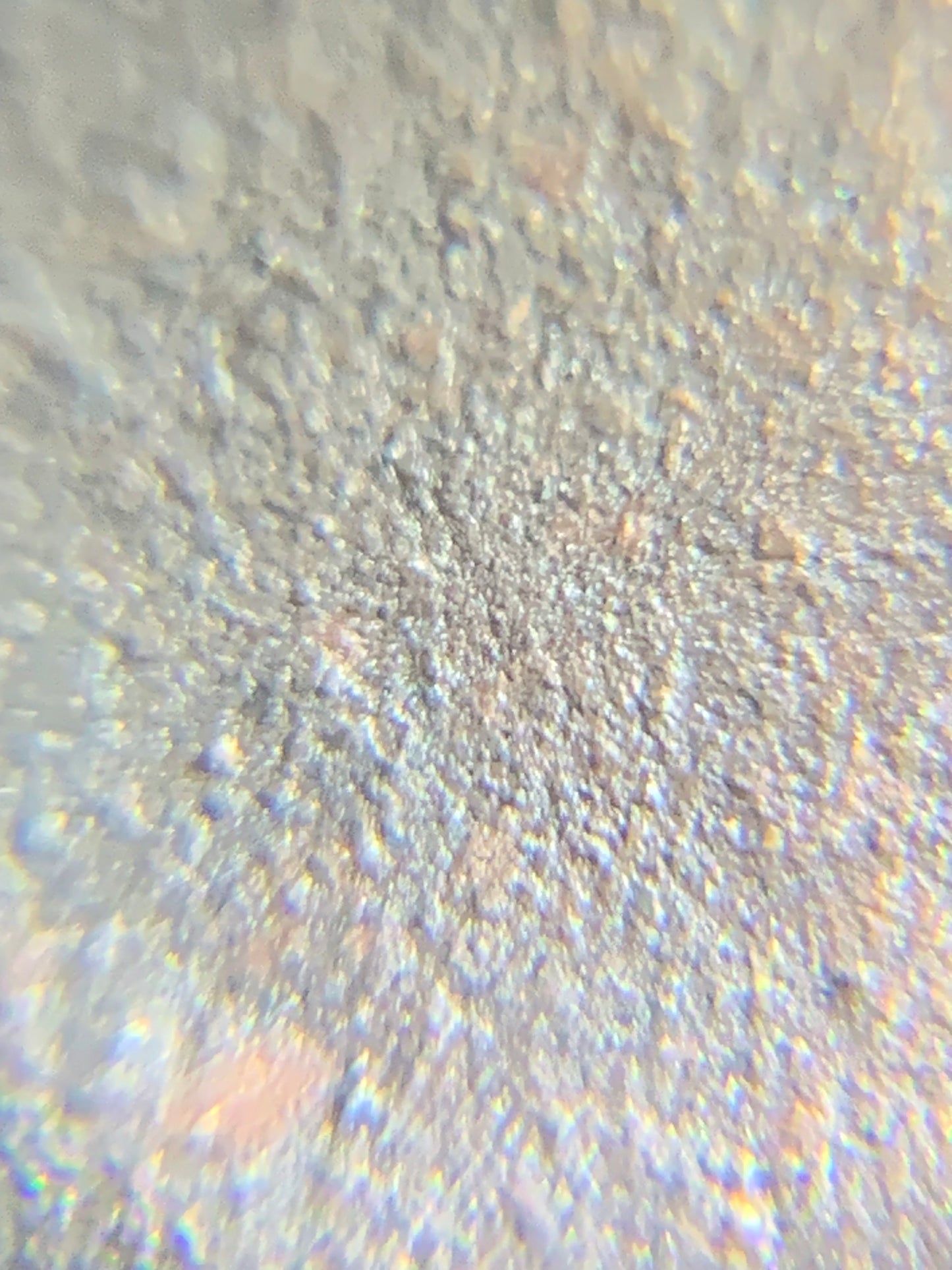Enlarged purple clay