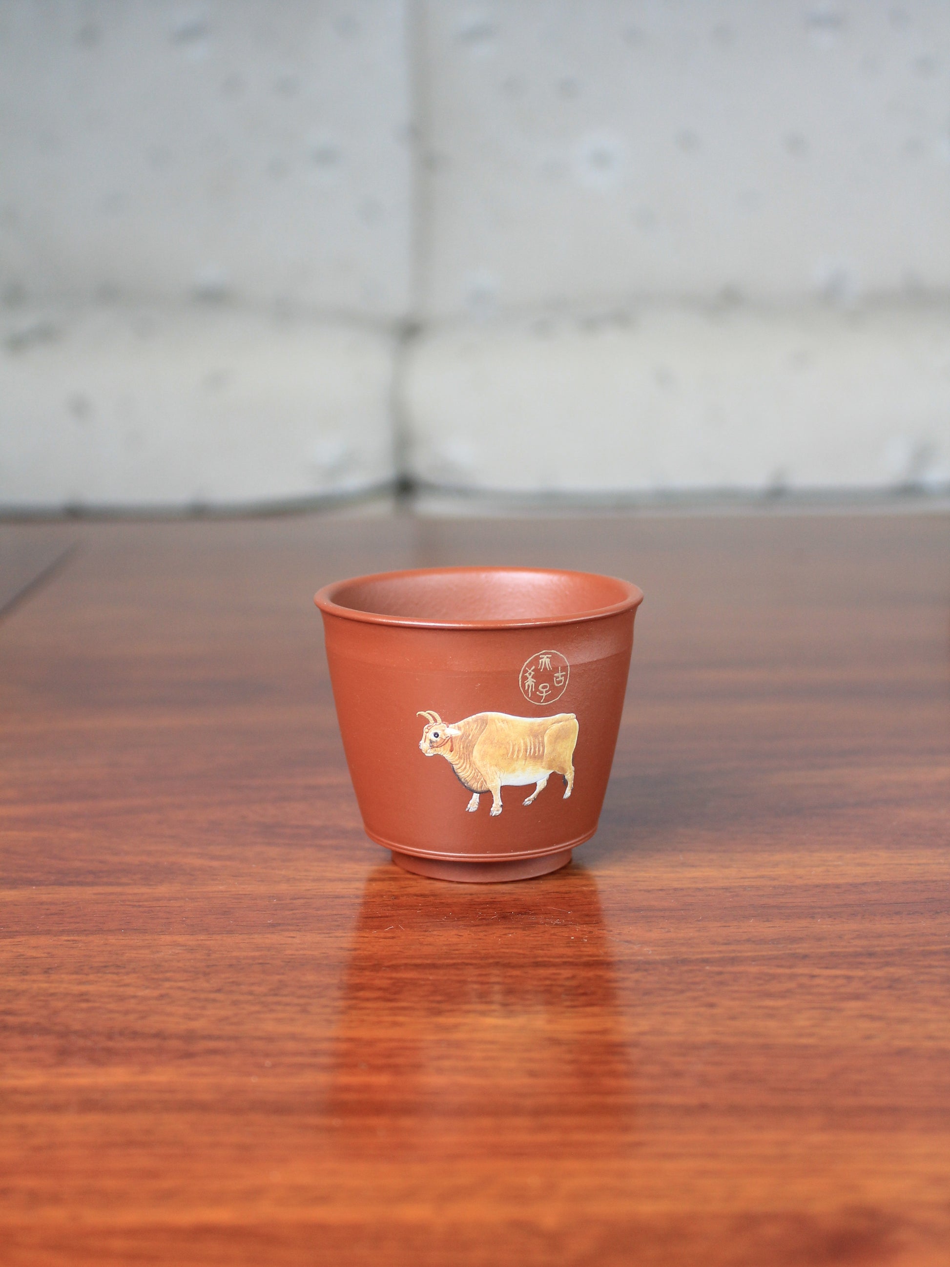 Vintage teacup with bull pattern