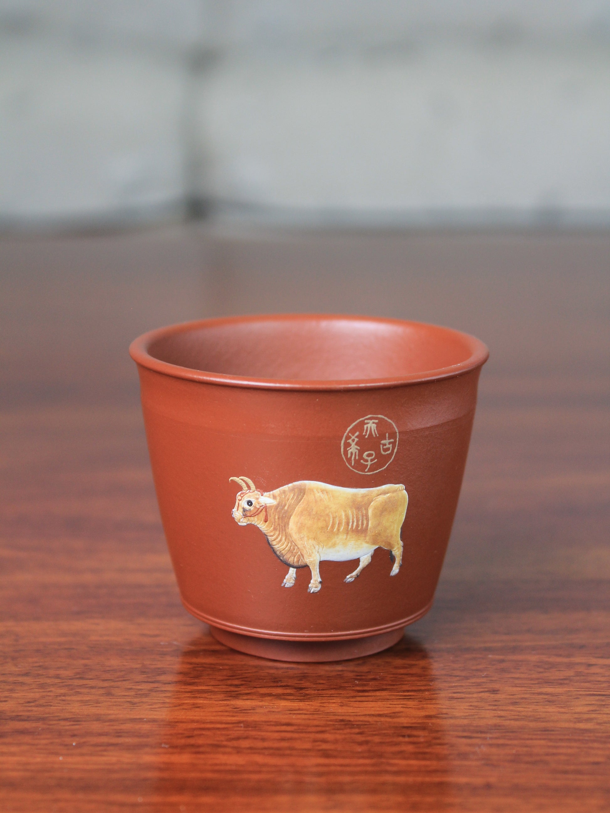 Details of the vintage teacup with bull pattern