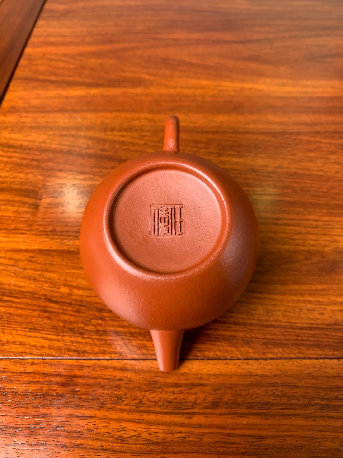 There is a seal on the bottom of the teapot from the master potter Wei Ren.