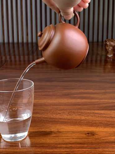 perfect pour of the yixing clay teapot