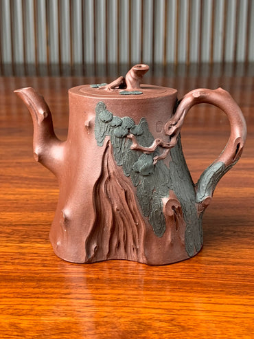 yixing teapot zisha pine tree handmade with di cao qing on the table