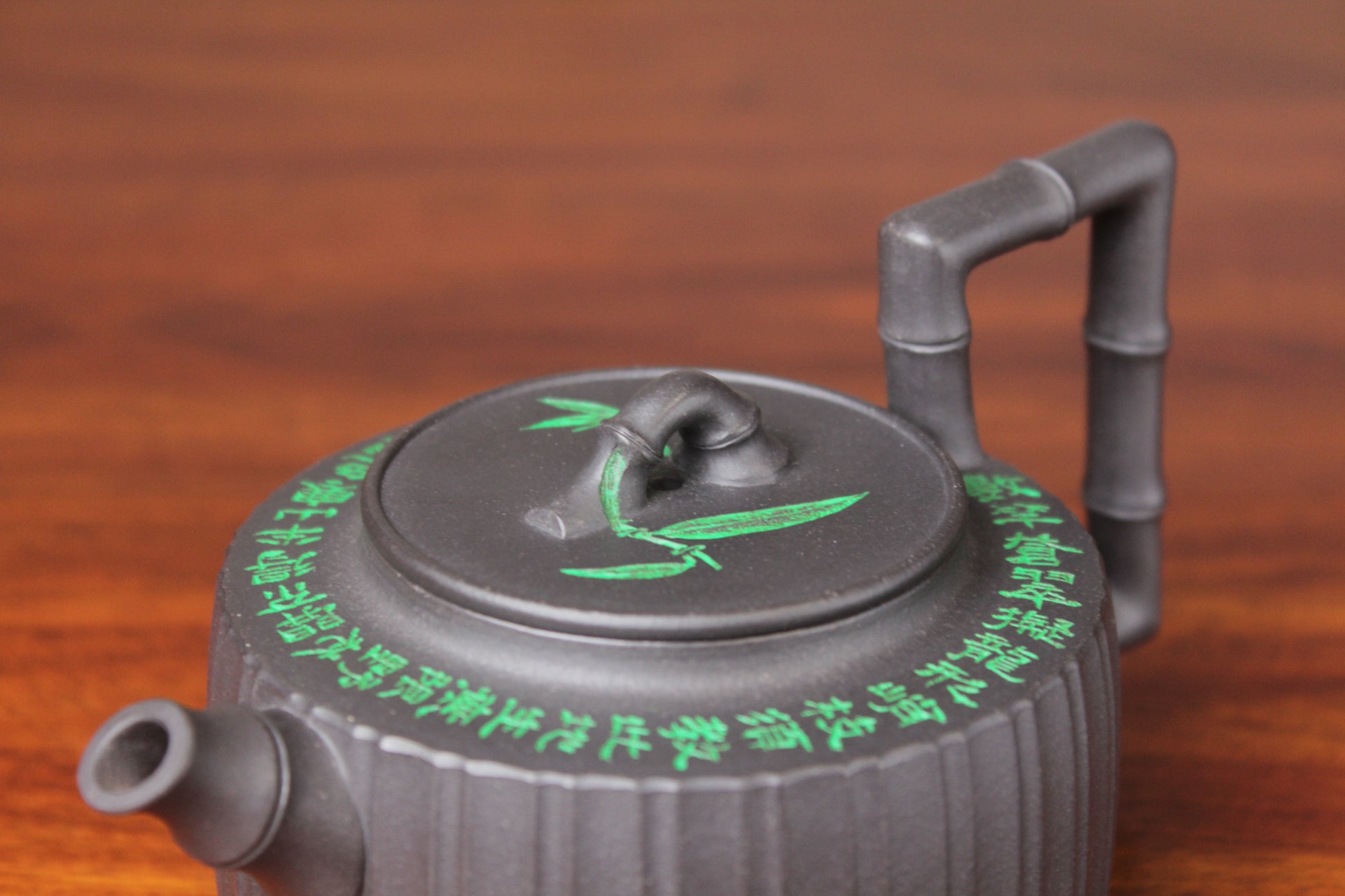 details of the vintage teapot handmade with purple clay on the table