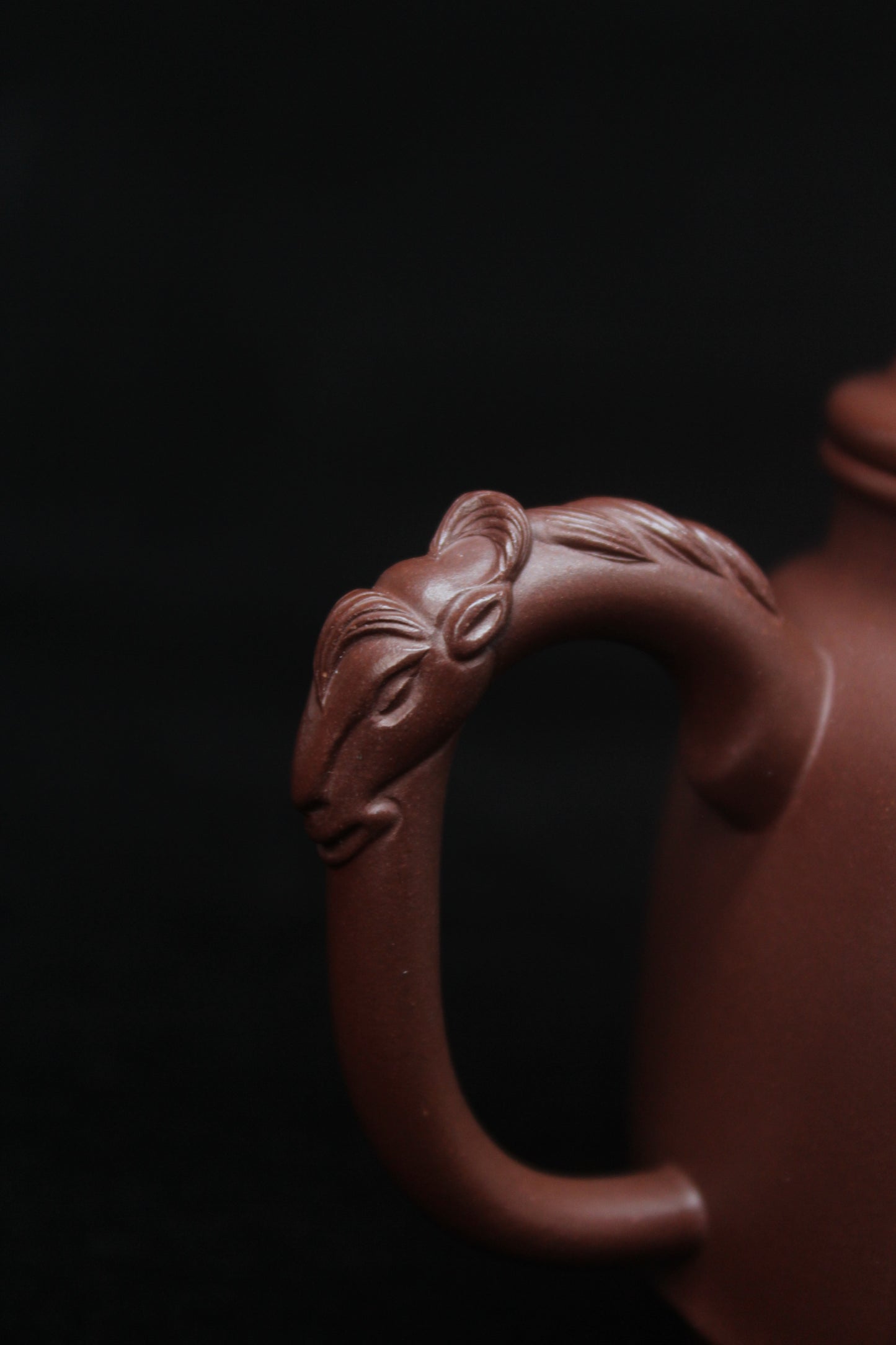 Handle of Vintage teapot come from zisha art gallery handmade with purple clay