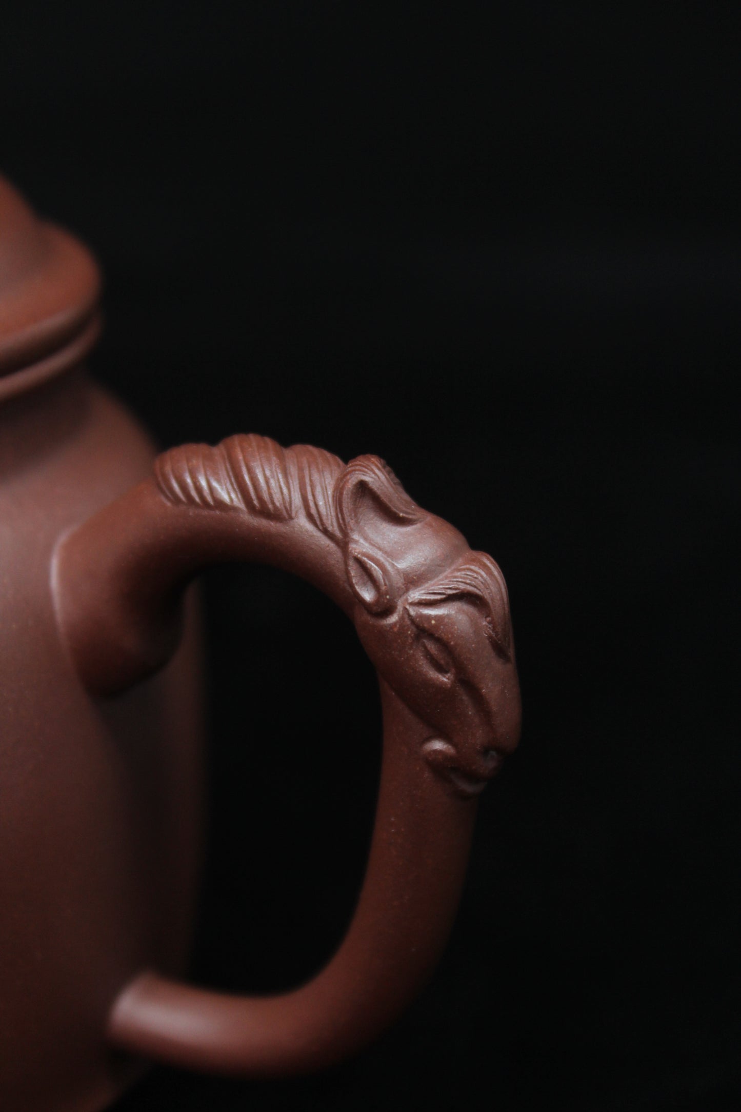 Handle details of Vintage teapot come from zisha art gallery handmade with purple clay