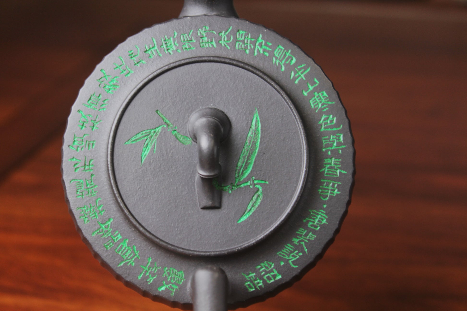 lid detail of the vintage teapot handmade with purple clay on the table