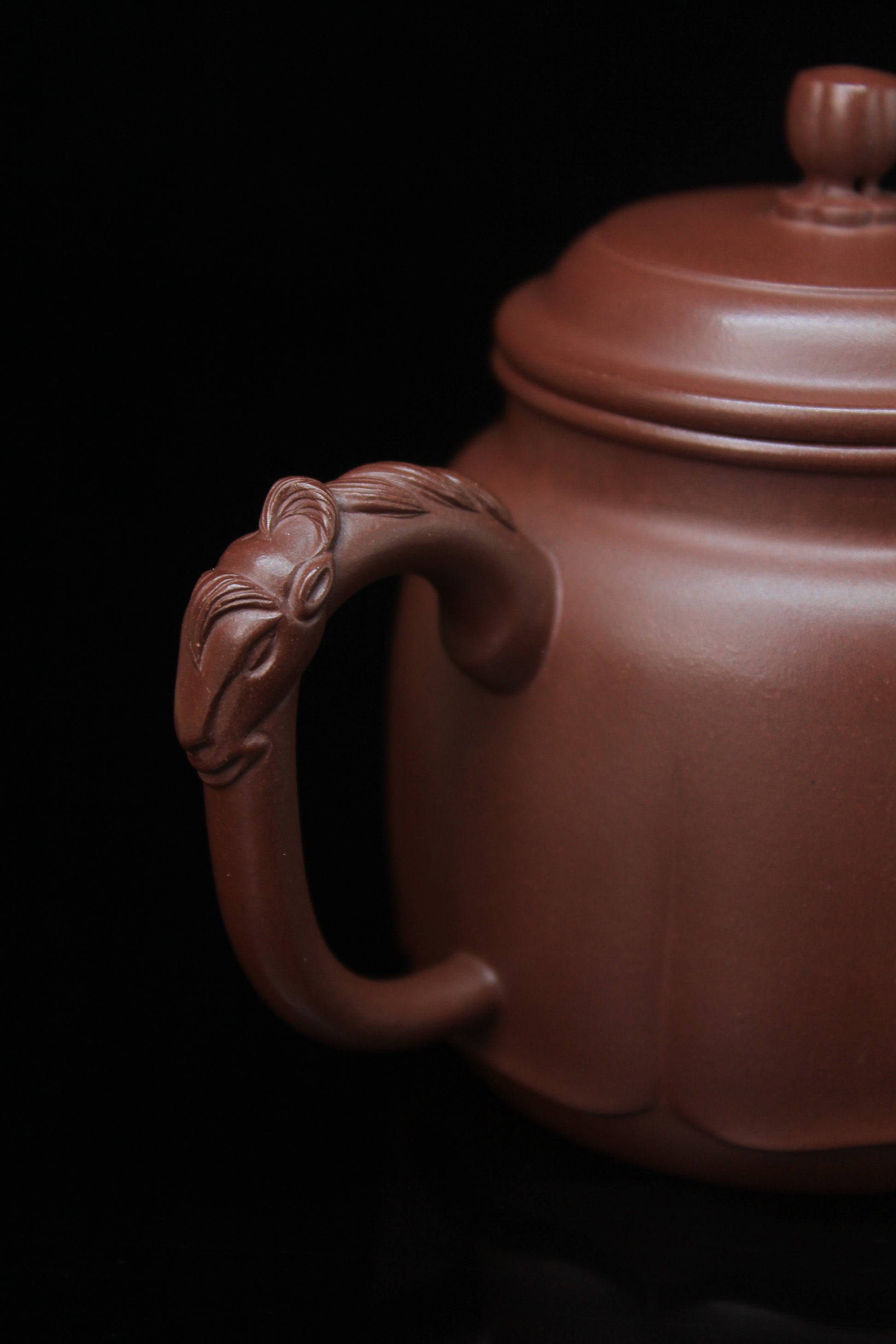 Handle of Vintage teapot come from zisha art gallery handmade with purple clay