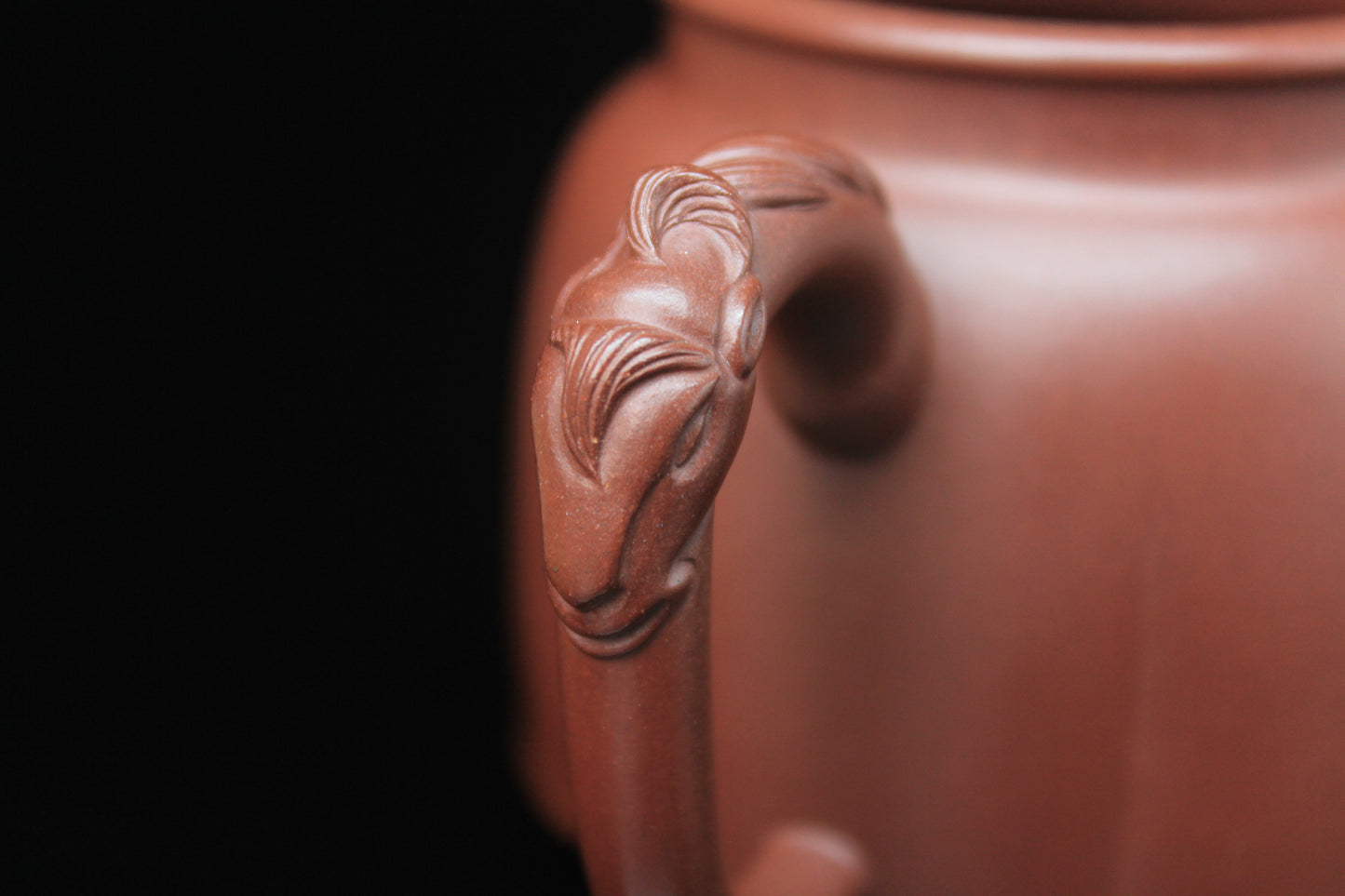 Handle detail of Vintage teapot come from zisha art gallery handmade with purple clay