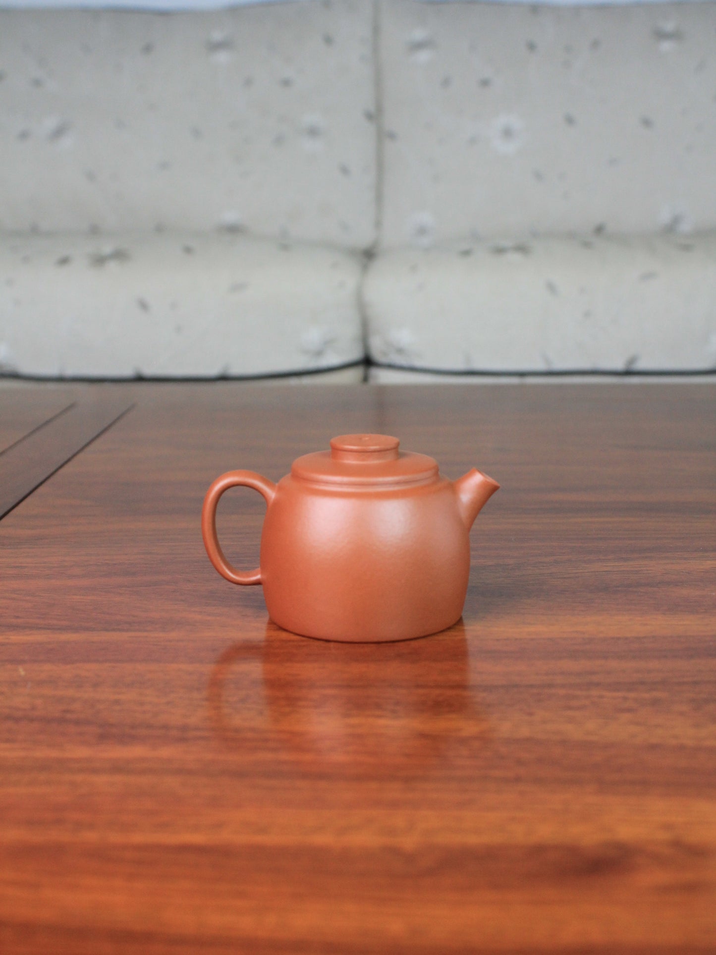 Back view of yi shing teapot named de zhong handmade with yixing clay