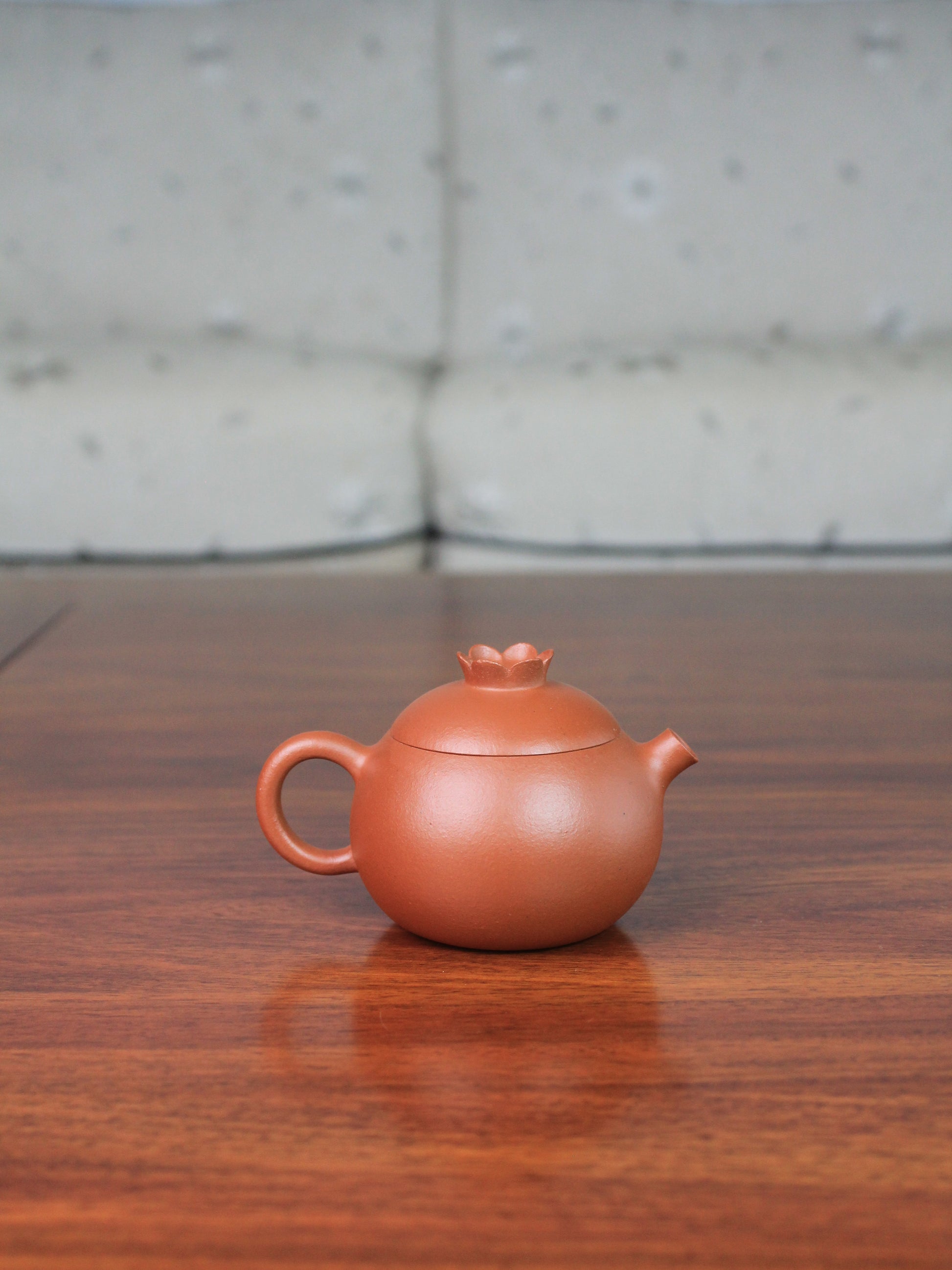 back view of yi shing teapot named flower on the table