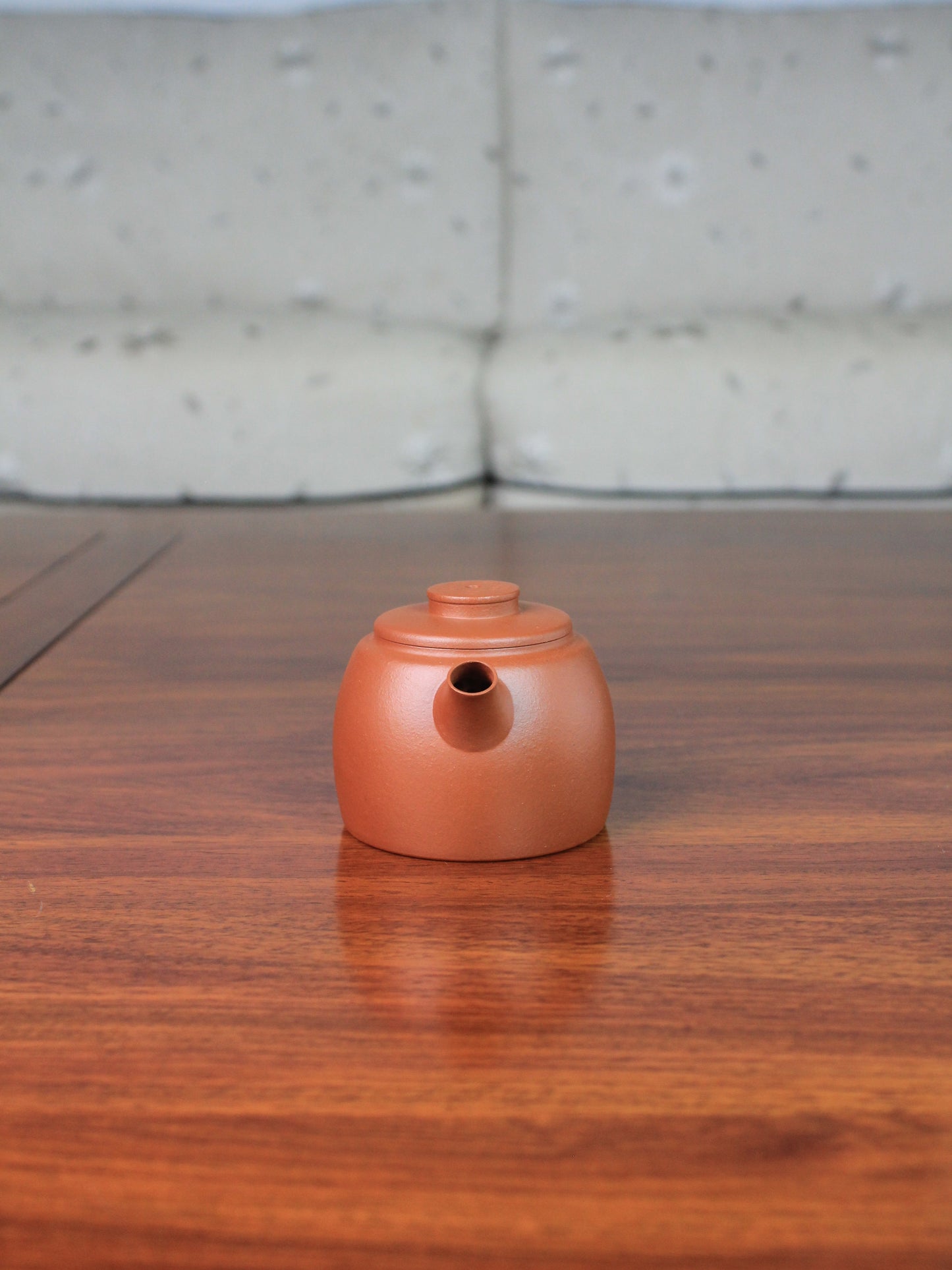 Front view of yi shing teapot named de zhong handmade with yixing clay