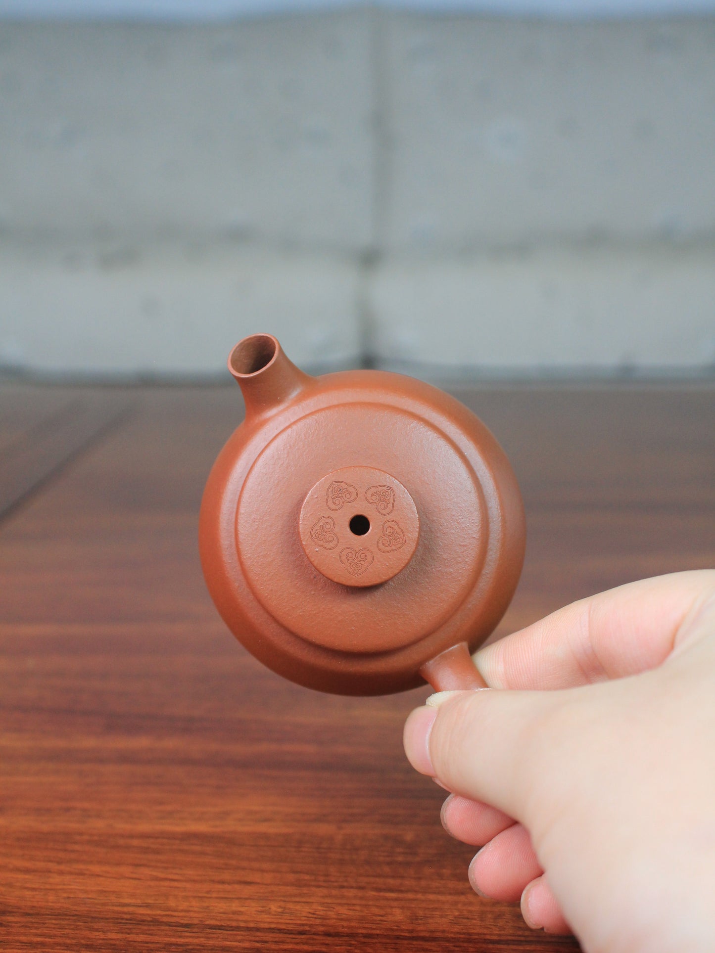 Detail of yi shing teapot named de zhong handmade with yixing clay