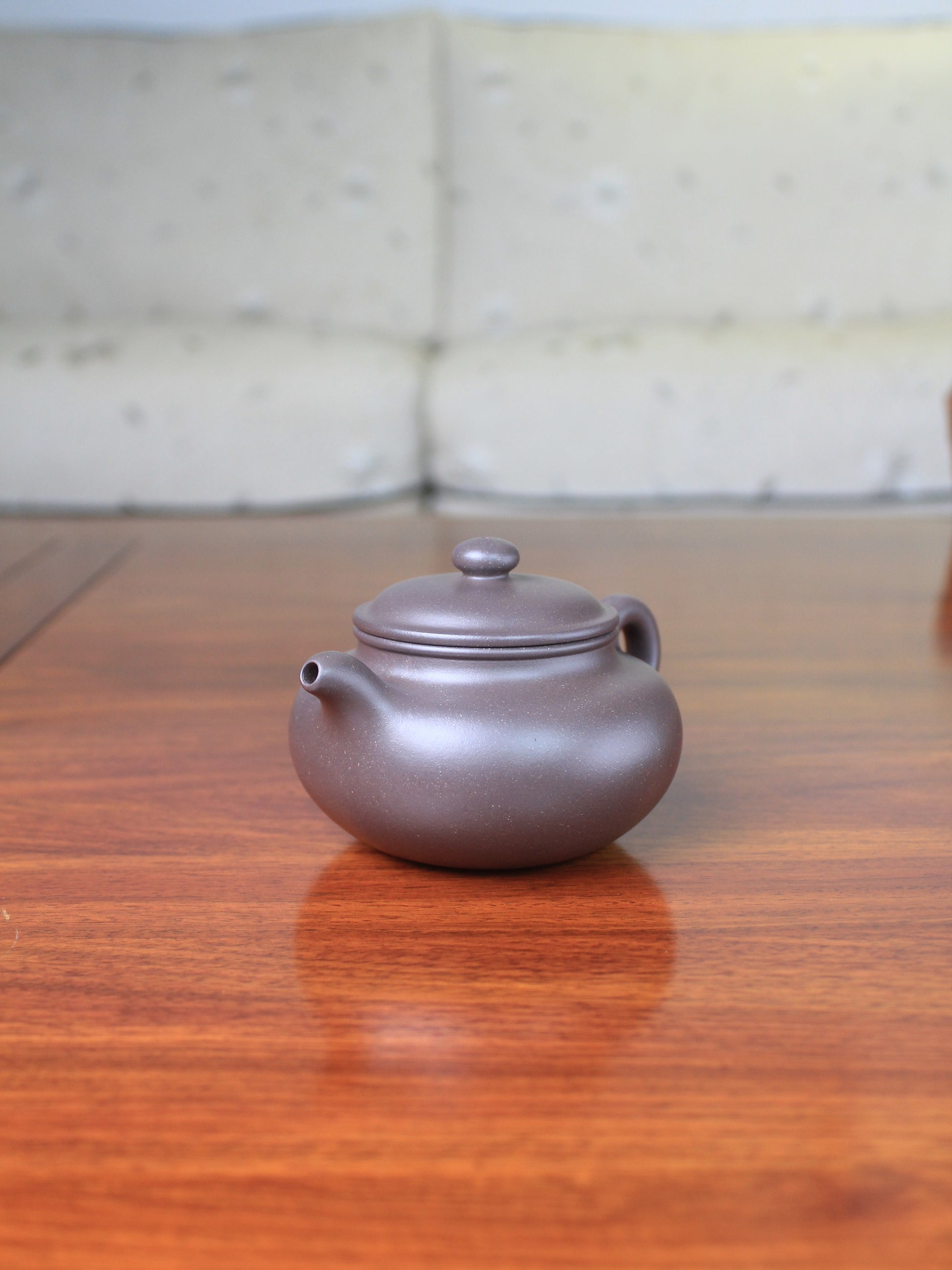Right view of yi sing teapot on the table