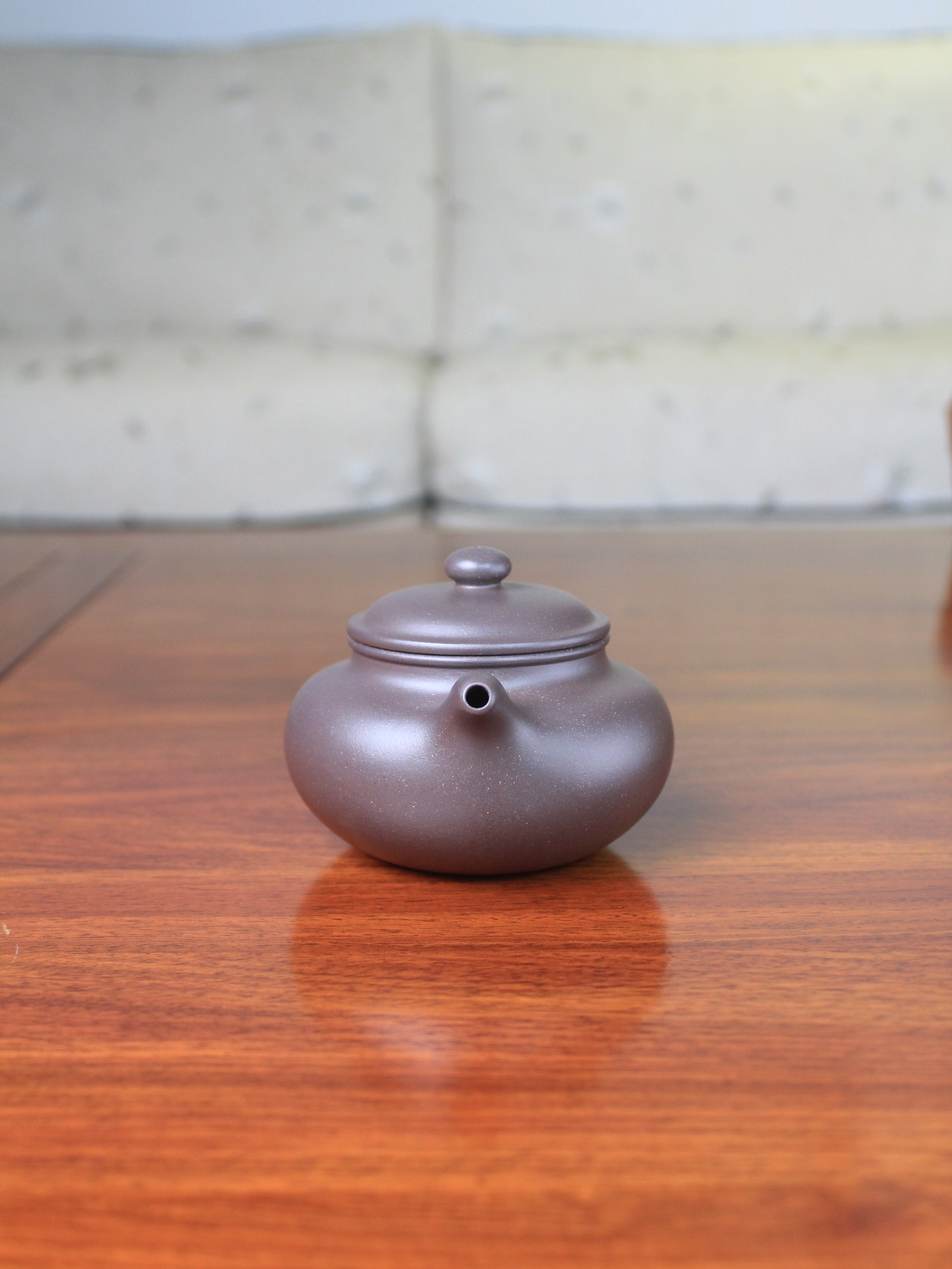 Front view of the yi sing teapot on the table