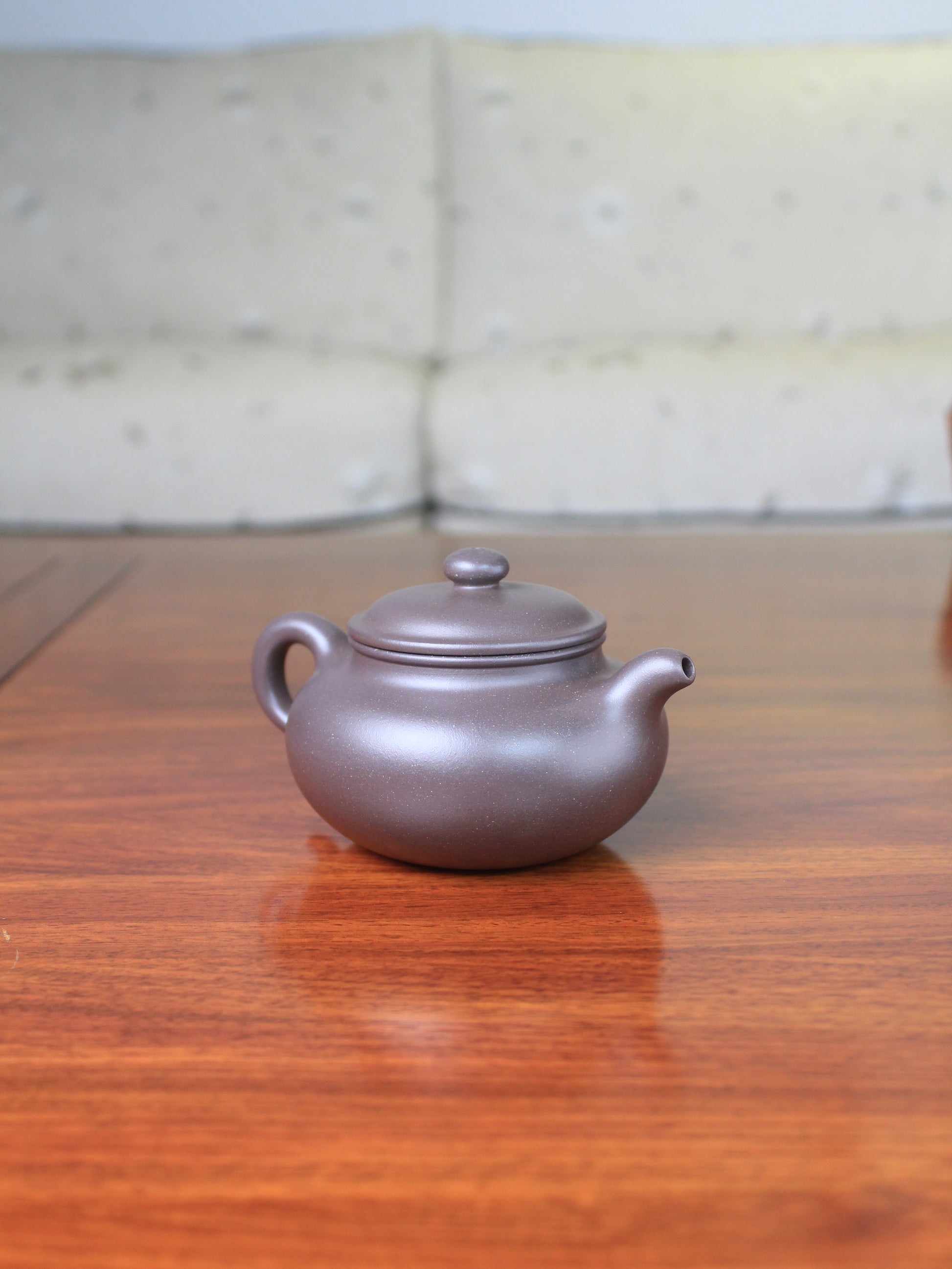 Left view of the yi sing teapot on the table