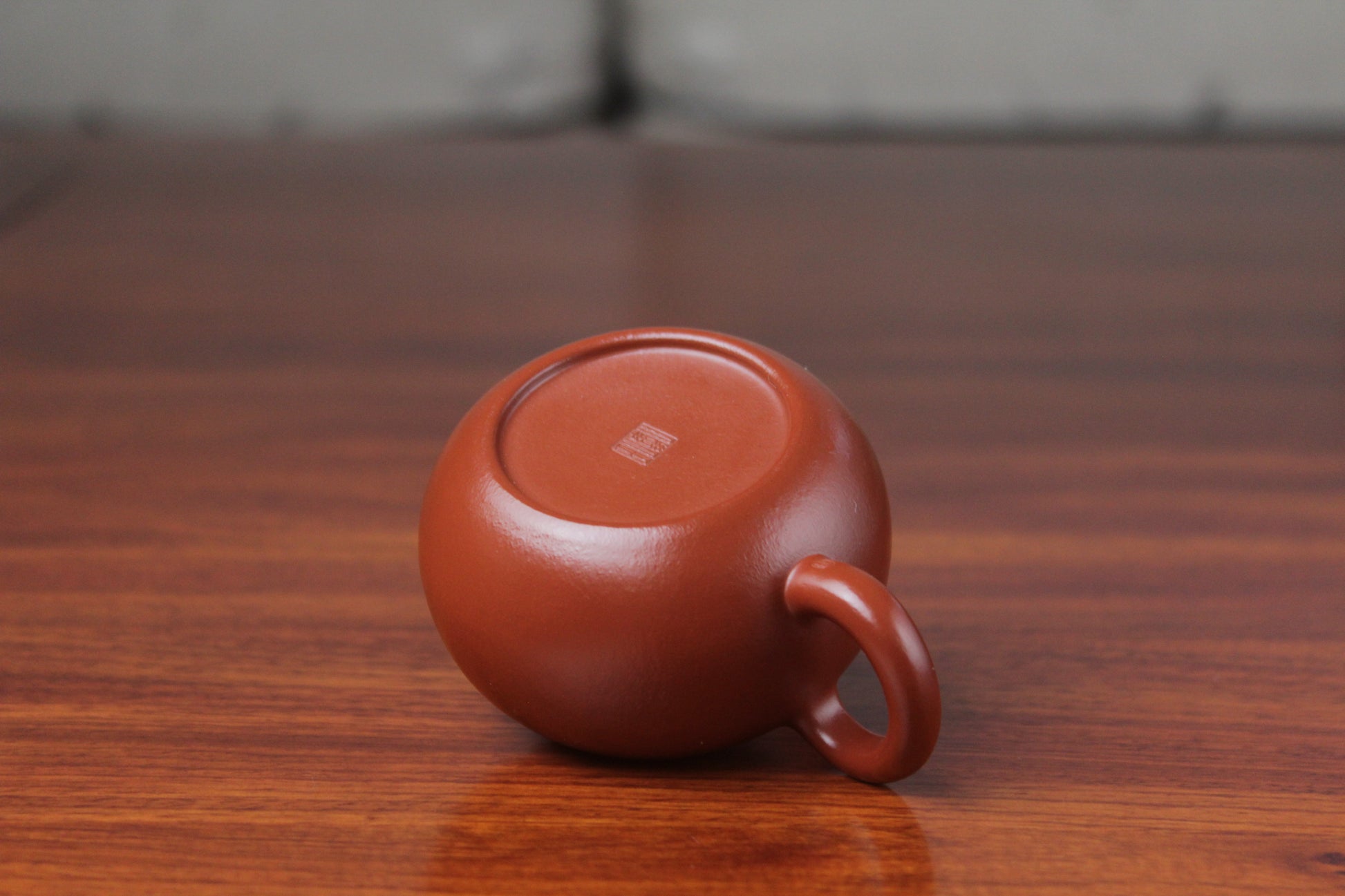 bottom of the yixing clay teapot xishi on the table