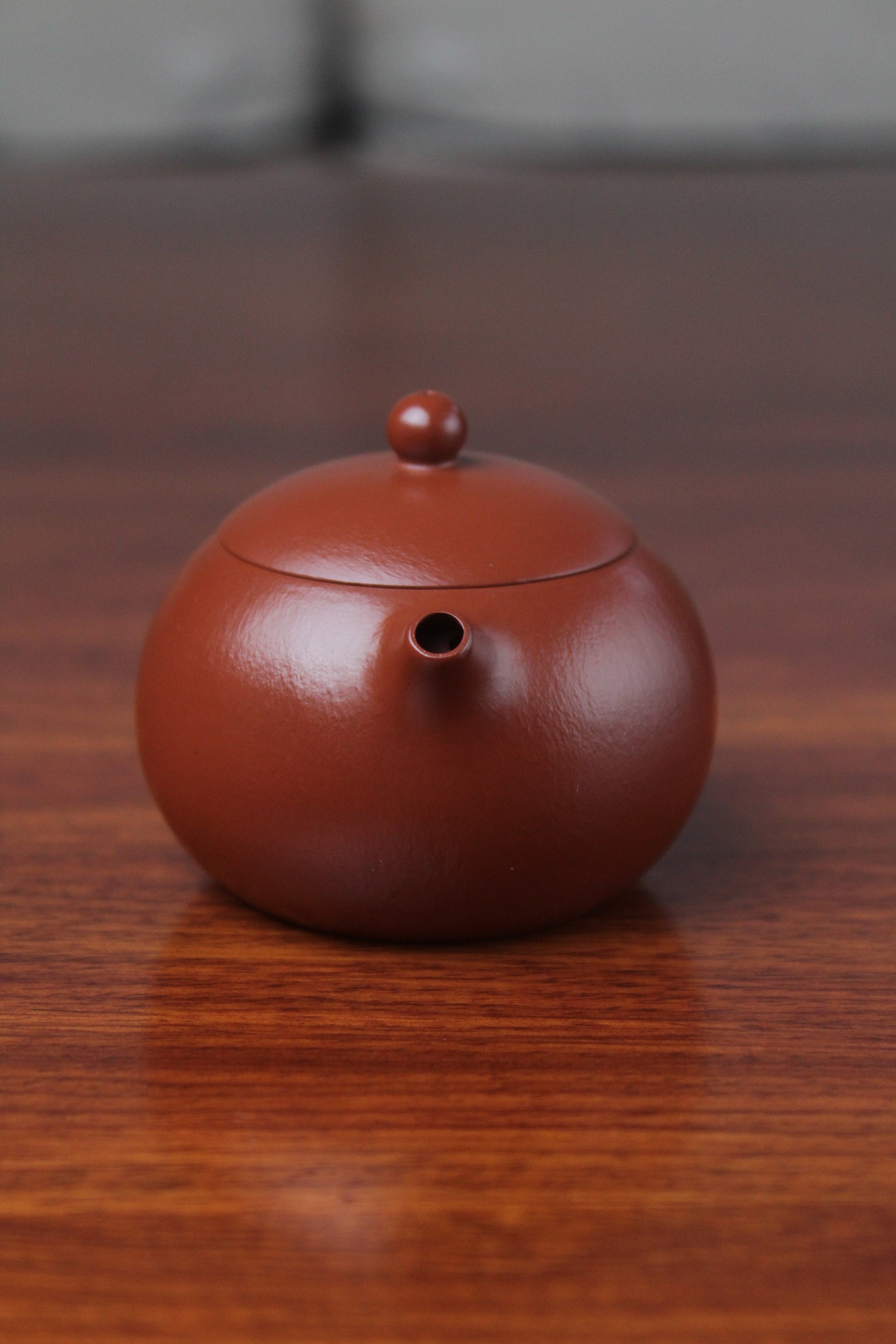 spout of the yixing clay teapot xishi on the table details
