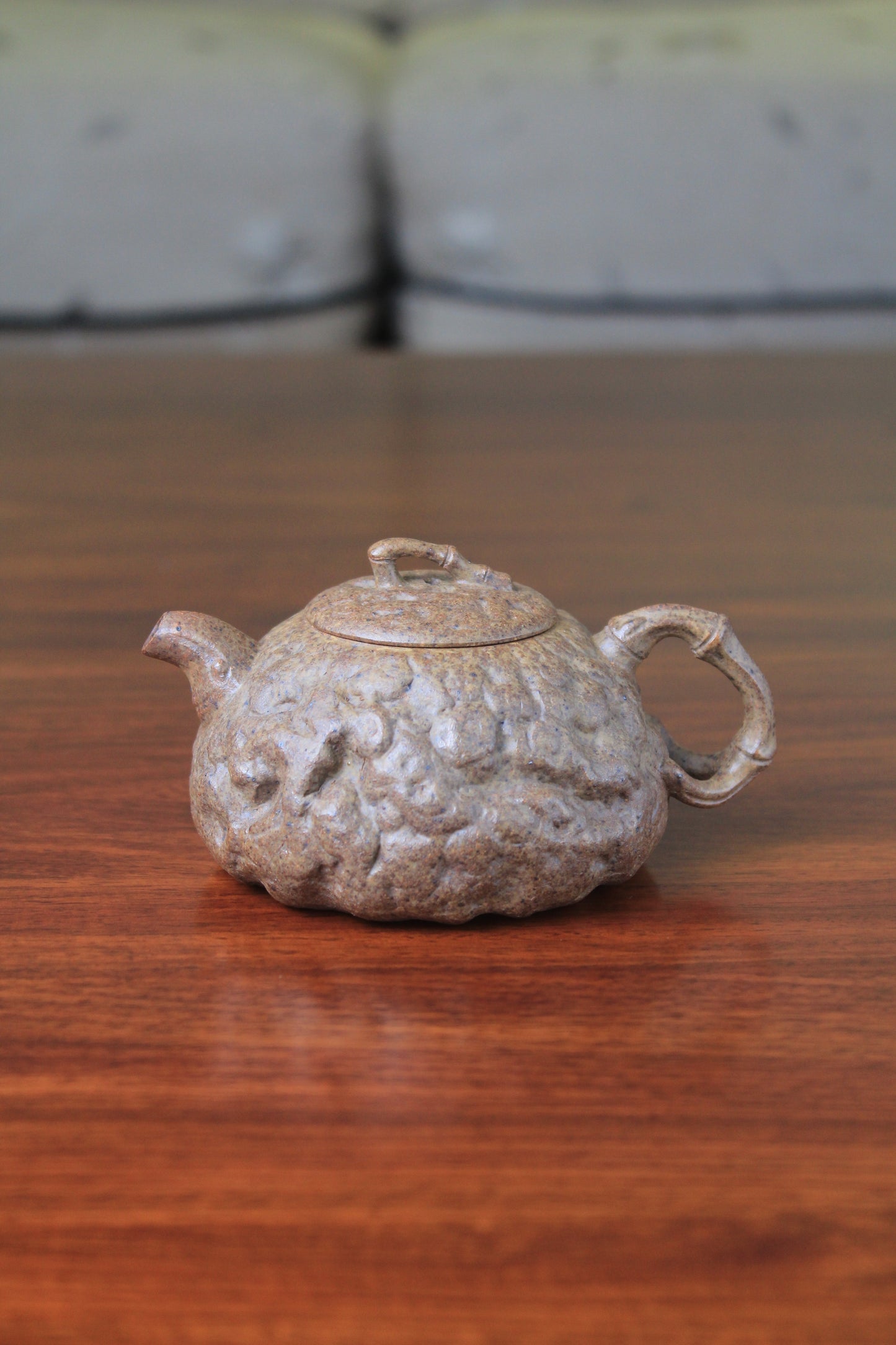 yixing teapot gong chun fully handmade with purple clay on the table