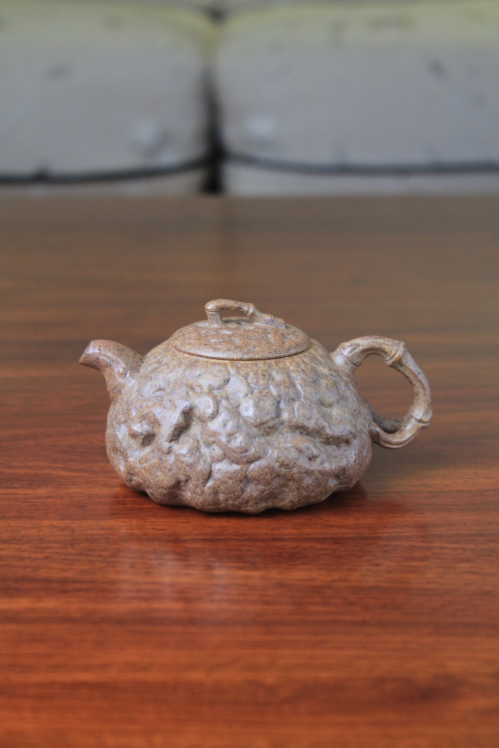 yixing teapot gong chun fully handmade with purple clay on the table