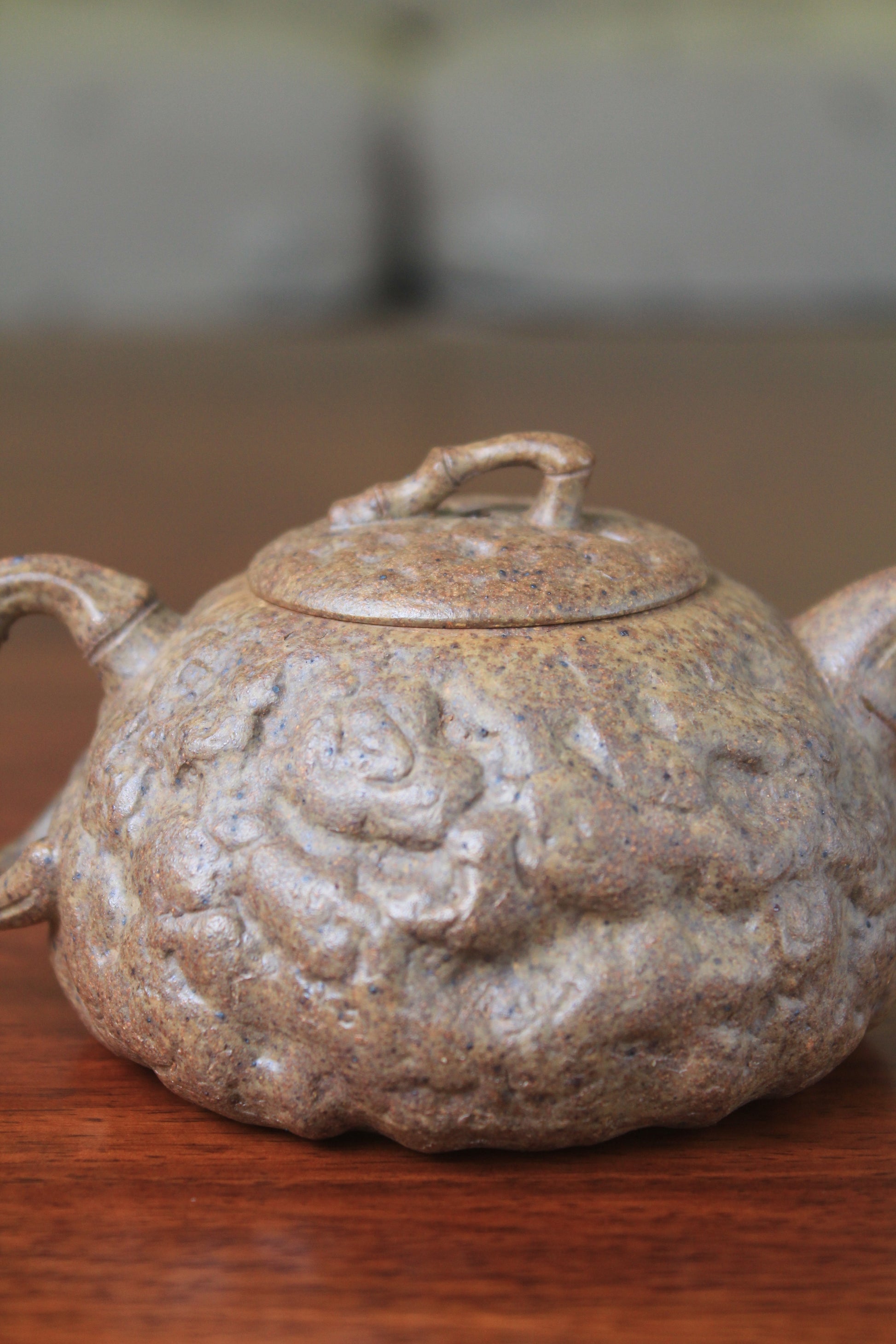 detail of yixing teapot gong chun fully handmade with purple clay on the table