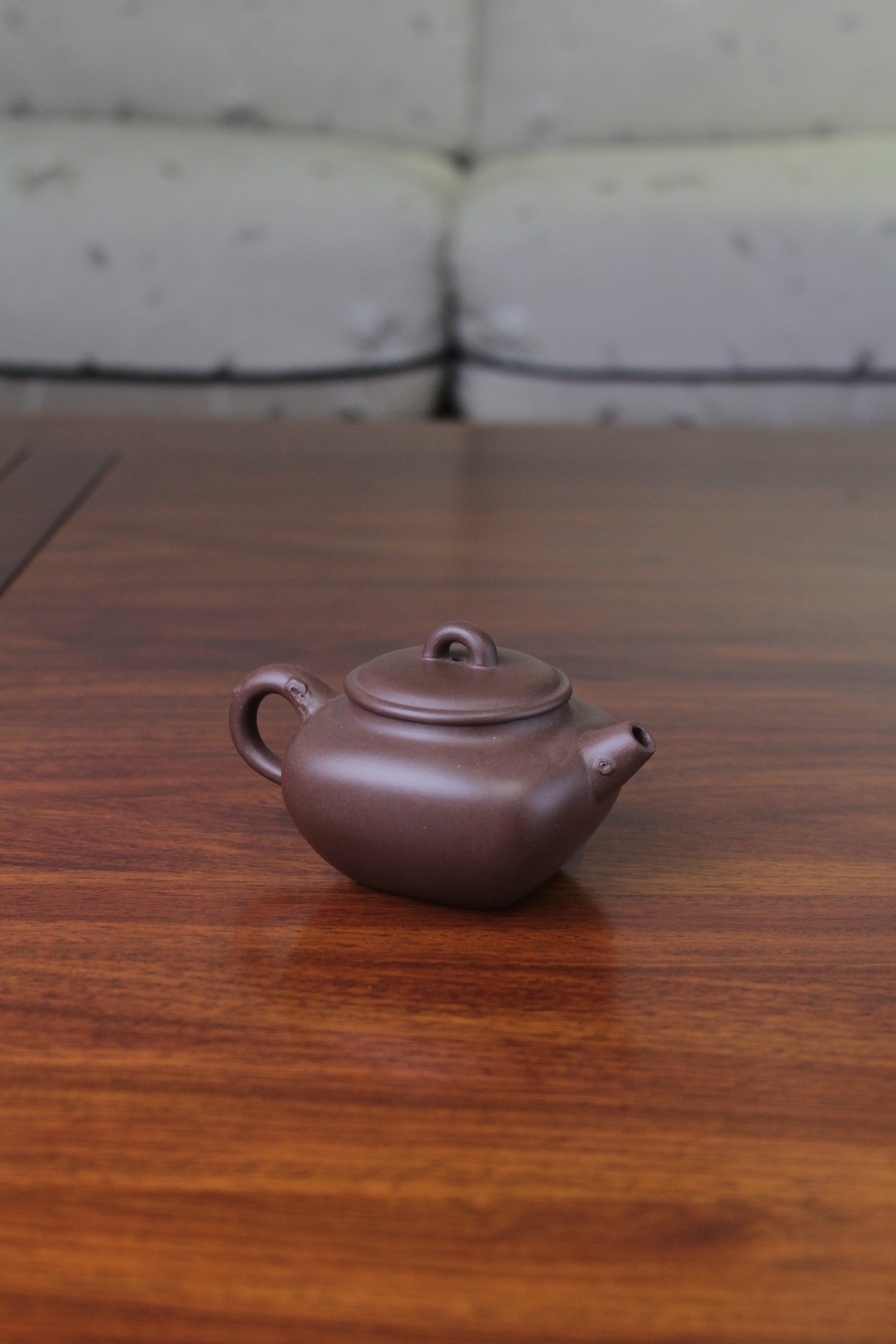 Back view of yixing teapot named flower on the table