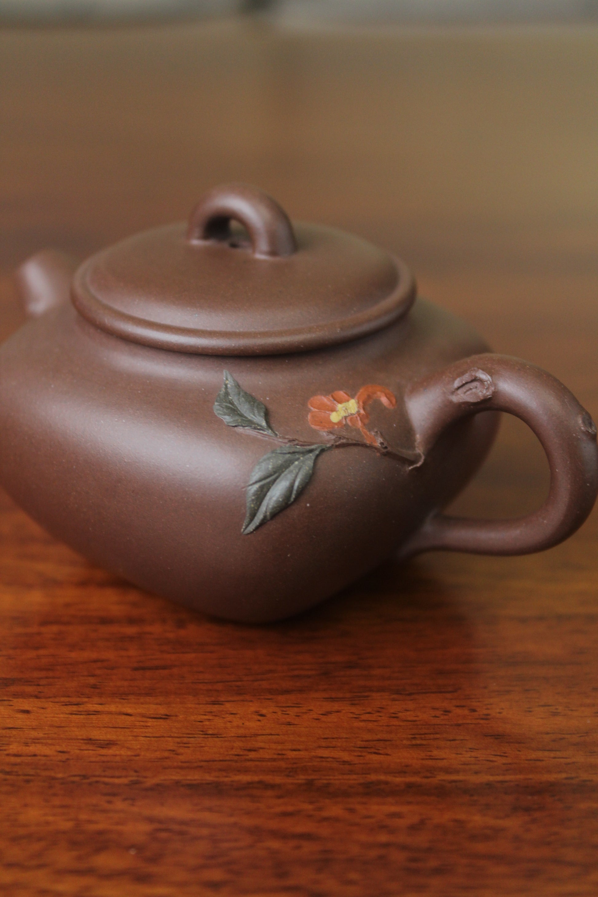 Details of the yixing teapot named flower on the table