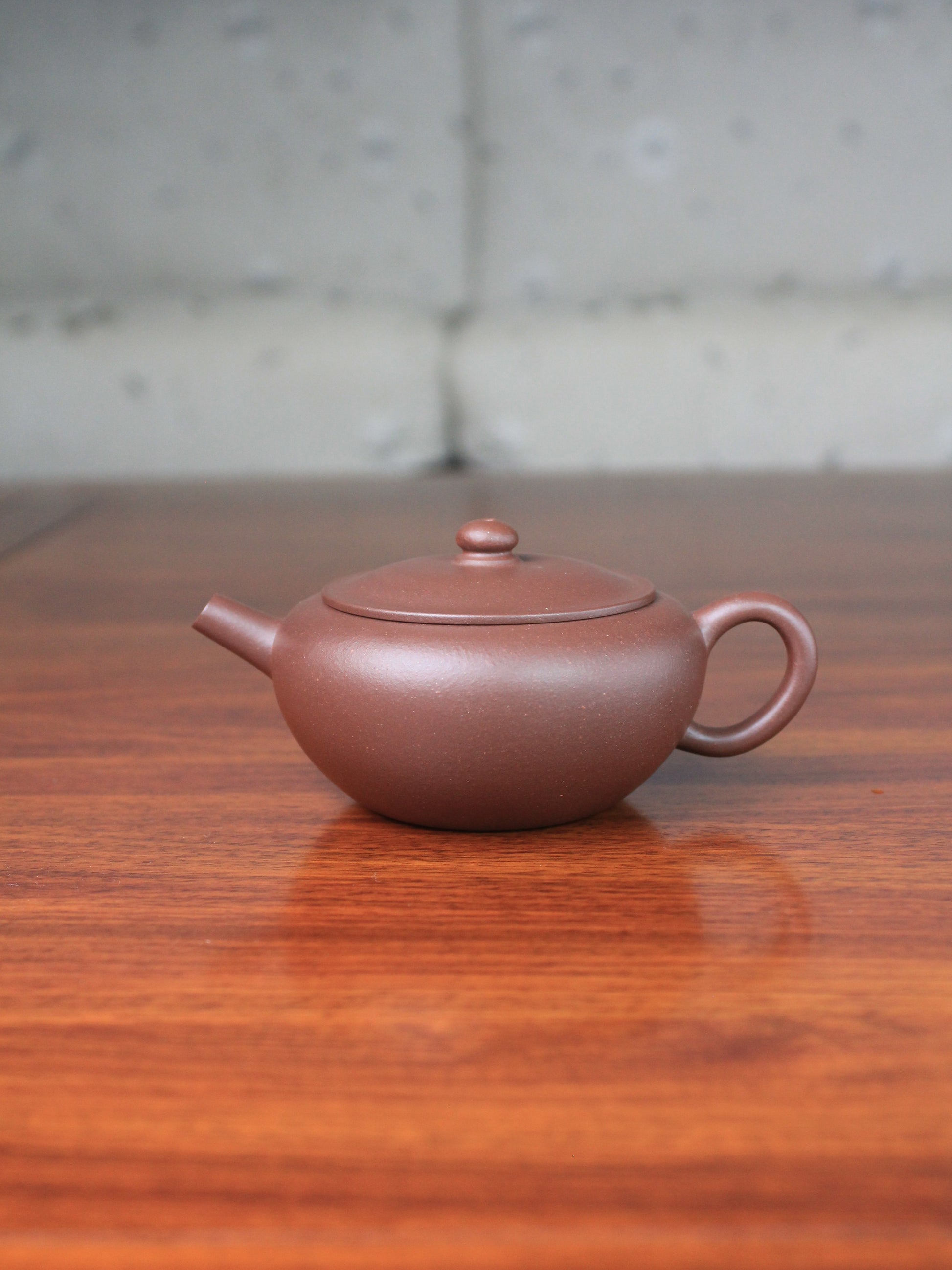 yixing teapot handmade by teapot artist with purple clay