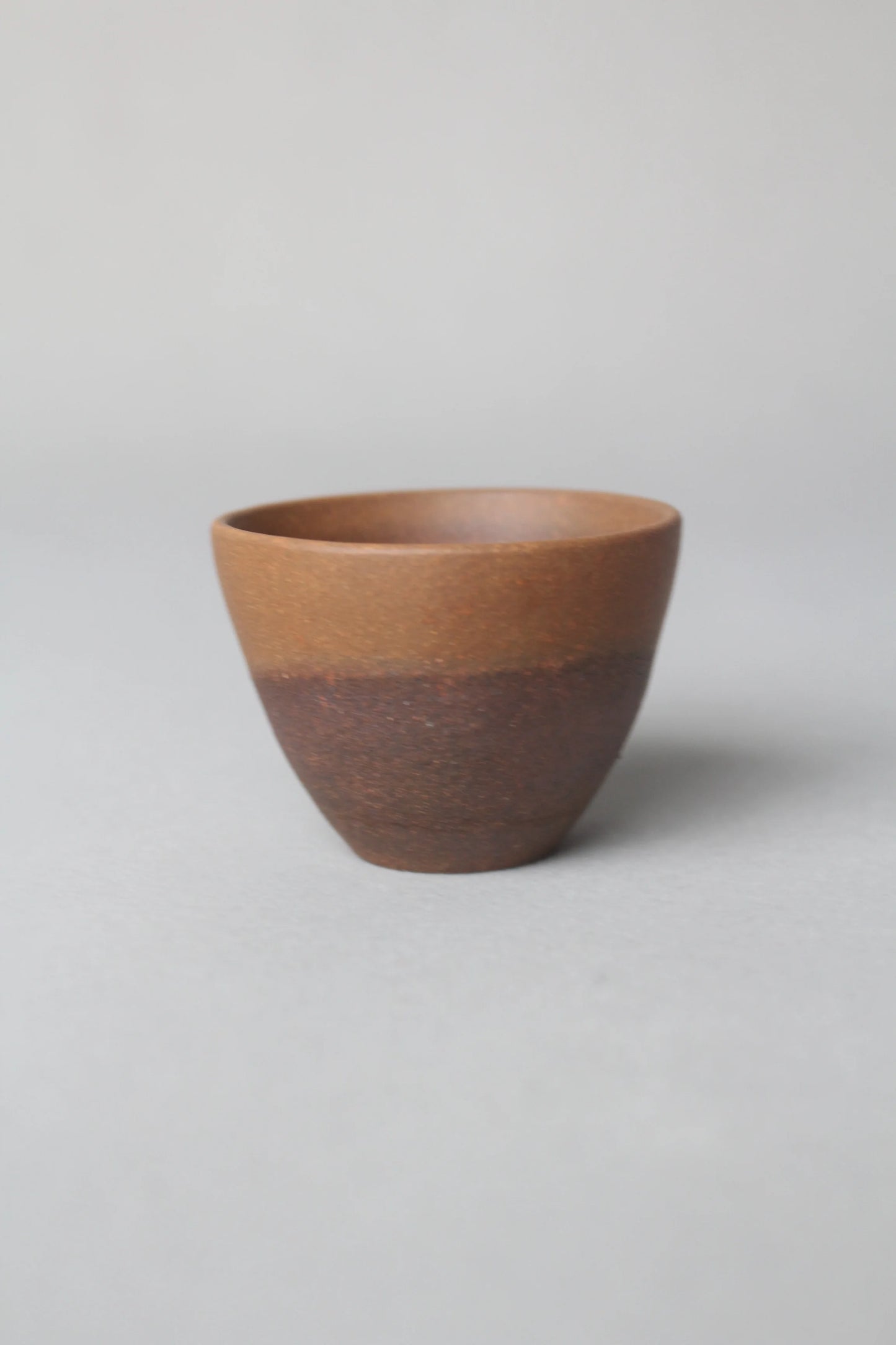 a zisha teacup is on the table left view