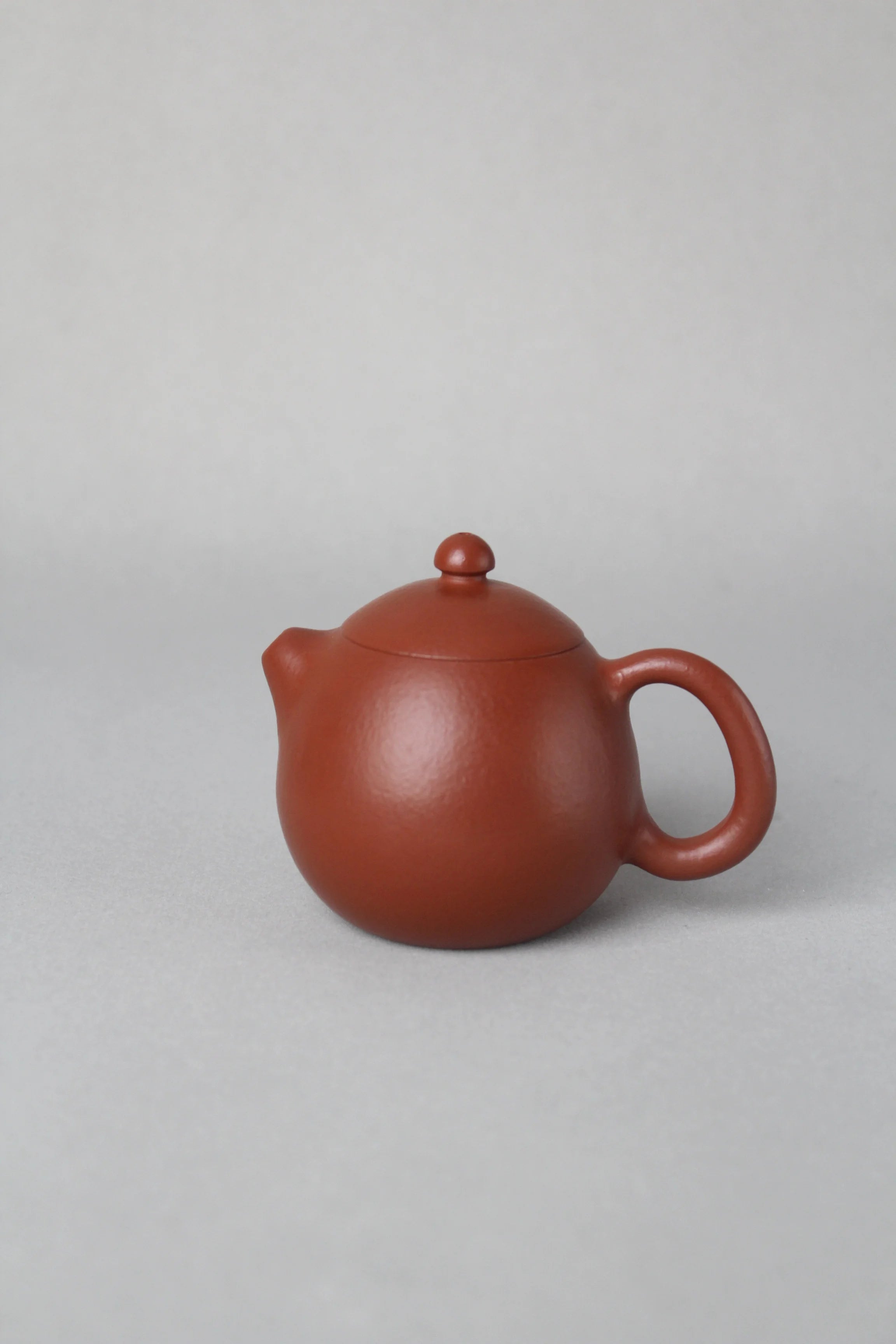 cute small dragon egg zisha teapot on the table