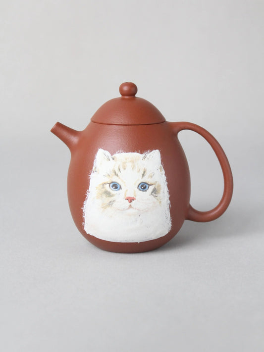 There is a cat painting on this dragon egg zisha teapot