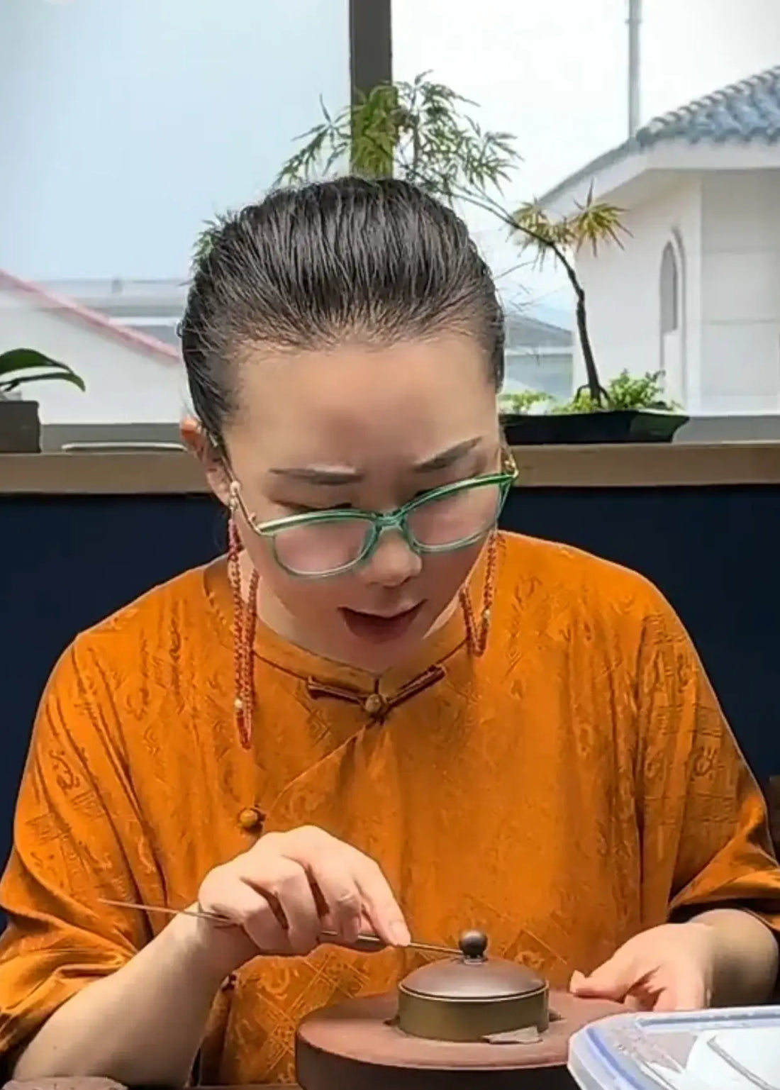 yixing teapot artist Zhu Dan is making a teapot