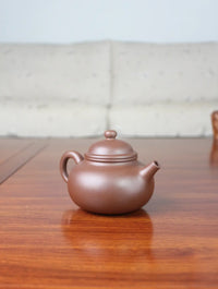 left view of zisha teapot rong tian