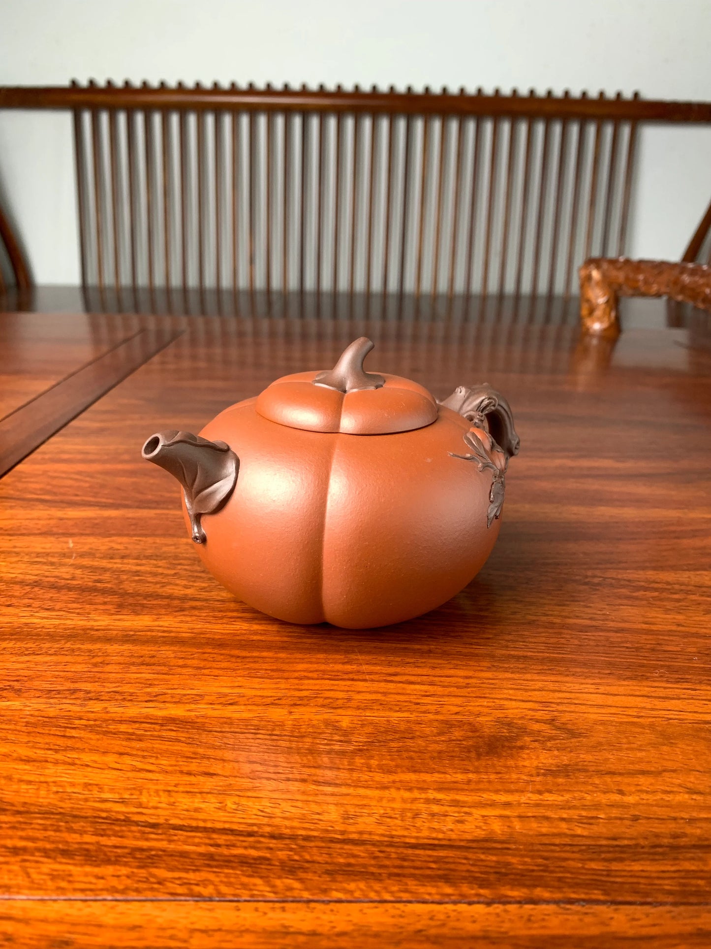side view of art collection teapot named pumpkin on the table